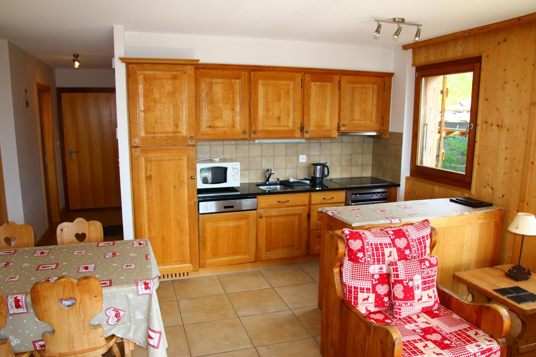 On the 2nd floor: (Living room(double sofa bed(140 x 200 cm), TV(cable, satellite), dining table, seating area), open kitchen(electric kettle, toaster, coffee machine(filter), oven, microwave, dishwasher, fridge, freezer, dishes and cutlery, Cooking basics), bedroom(single bed(90 x 200 cm), single bed(90 x 200 cm)), bathroom(shower, washbasin, toilet), bathroom(bath tub, washbasin, toilet), Internet access)\n\nski storage, DVD player, tumble dryer, washing machine, balcony, heating(central), garden, garden furniture, parking, lift, hairdryer, Laundry Package incl.