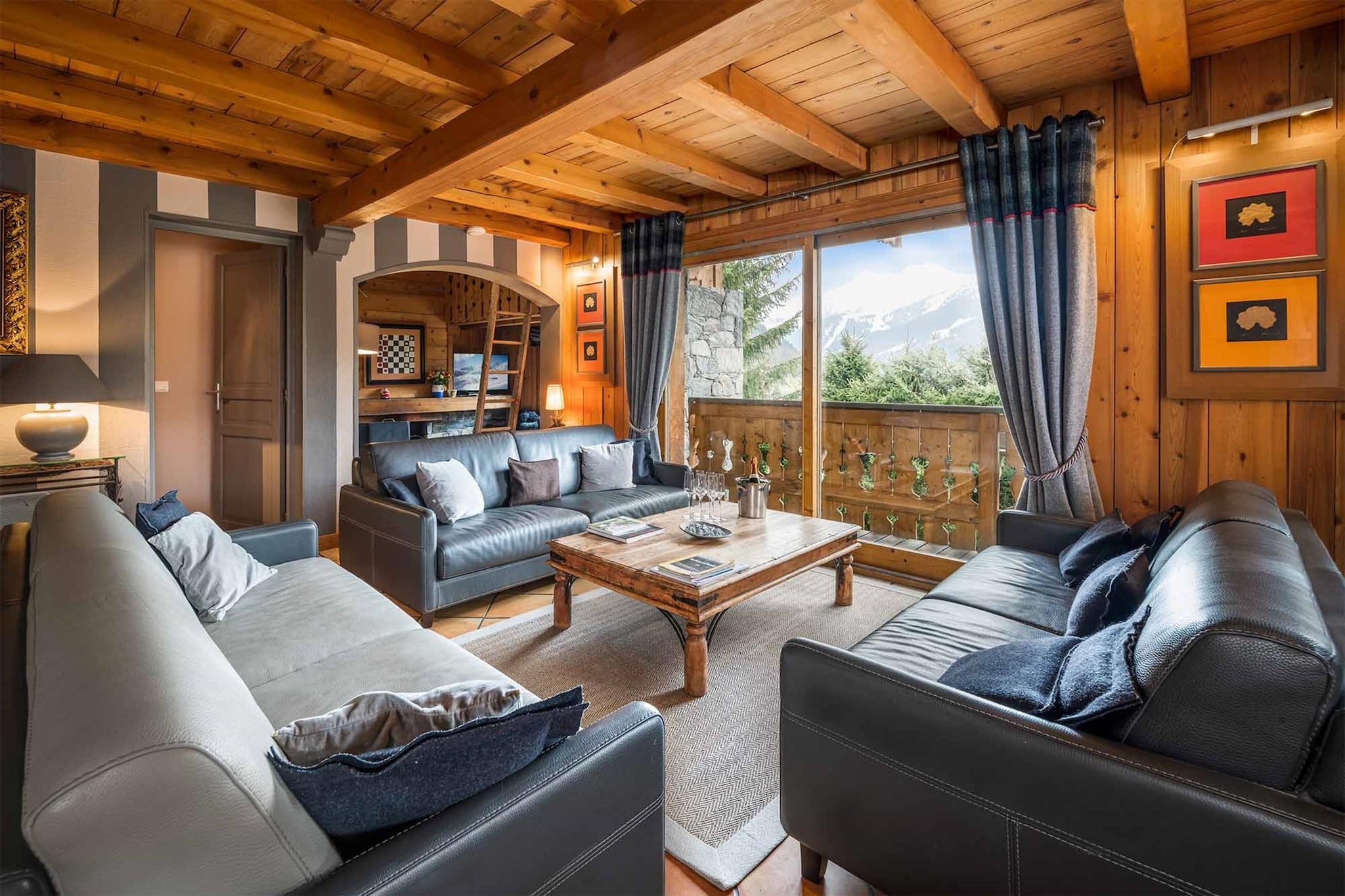 Chalet Etienne is a beautiful chalet for 15 people located in Méribel Village, one of the most popular areas of Méribel. Méribel Village is just a few minutes by bus from the lively centre of Méribel, although this hamlet also has its own centre with some popular places to eat and drink, a small supermarket, bakery and easy access to the slopes. The chalet is just a 5 minute walk from the nearest ski lifts and slopes, from where you can easily access the rest of the ski area of Méribel and Les Trois Vallées.

Etienne has a large open plan living room on the first floor with a lovely large wooden dining table to seat everyone. There is another living area, the fireplace and TV corner, here you can relax whilst enjoying the gentle crackling of the fireplace and chilling in front of the TV or listening to music. Please note that all rooms are equipped with Italian beds, which offer the choice between two single beds and a double bed, each of the 7 bedrooms has its own private bathroom. There is a large driveway for up to four vehicles, which you can park in front of the chalet.