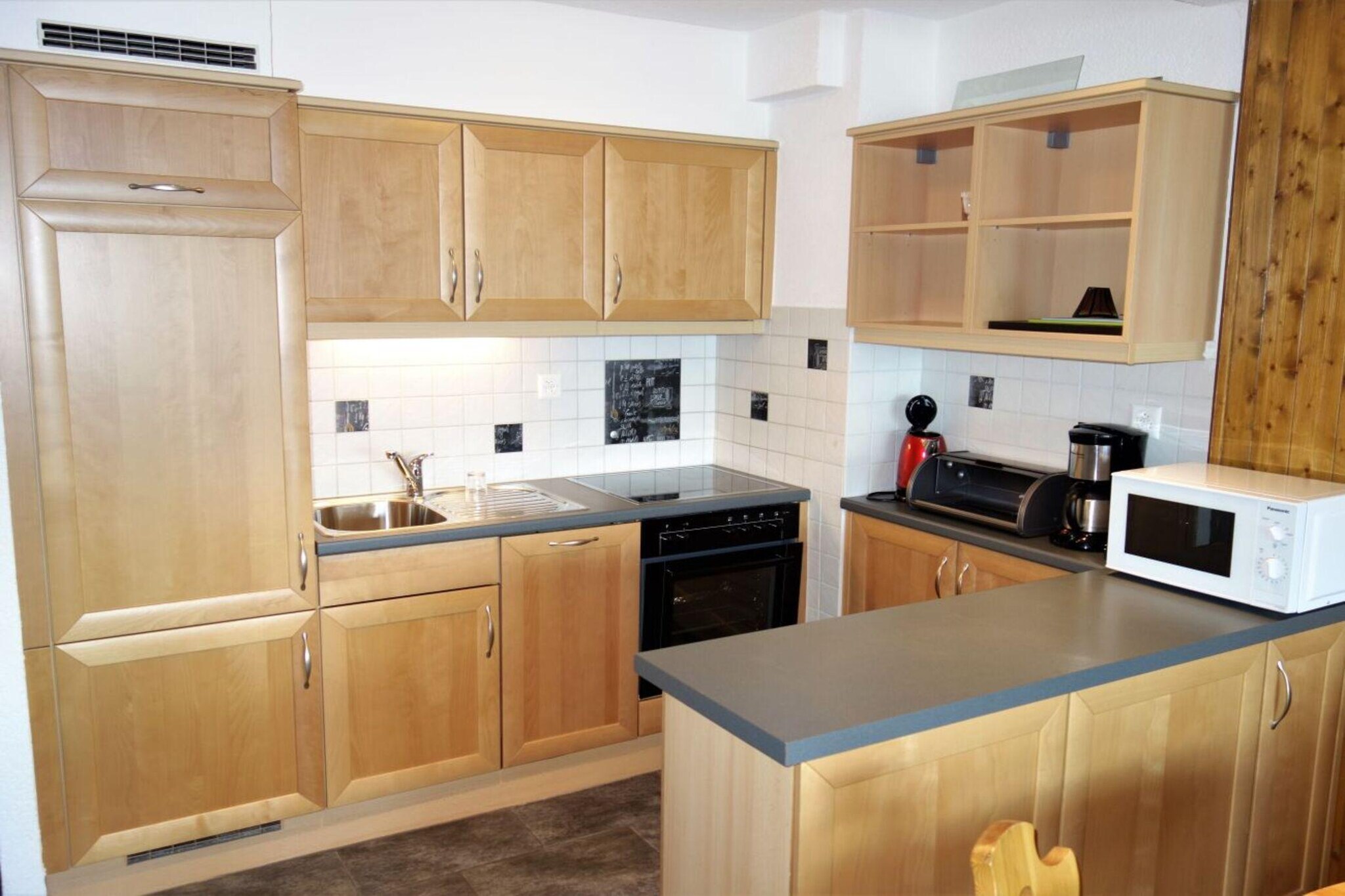 On the 3rd floor: (Living room, open kitchen(electric kettle, coffee machine(filter), oven, microwave, dishwasher, fridge-freezer, dishes and cutlery(Bowls, chopsticks, plates, cups, etc.)), Living/bed room(single sofa bed, single sofa bed, bunk bed(90 x 200 cm), TV(cable, satellite), dining table, fireplace, seating area, DVD player, radio, balcony), bedroom(single bed(90 x 200 cm), single bed(90 x 200 cm)), bathroom(bath tub, shower, washbasin, toilet), Internet access)\n\nski storage, washing machine, heating(central), garden furniture, parking, swimming pool(shared with other guests), lift, Laundry Package for a fee