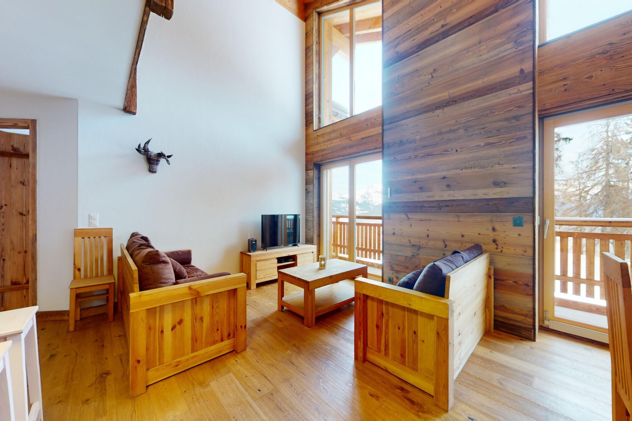 Set against the backdrop of the breathtaking Swiss Alps, this spacious apartment in Veysonnaz offers the perfect alpine retreat for families or groups looking to enjoy mountain charm and modern comfort. Located just 150 meters from the nearest ski lift, the apartment offers direct access to the renowned slopes of the 4 Vallées ski area, making it an ideal base for winter sports enthusiasts and summer hikers alike.
Inside, the apartment features a bright, inviting living area with a cozy setting and a generous dining table—perfect for shared meals after a day of adventure. The open-plan kitchen is well equipped with everything you need. Guests can enjoy views of the surrounding mountains from the private balcony, or unwind at the shared indoor swimming pool, just steps away.
Beyond the doorstep, head 15 km down to Ville de Sion, the charming cantonal capital filled with castles, vineyards, and vibrant weekly markets. Golf enthusiasts will enjoy the nearby Golf Club de Sion, while nature lovers shouldn’t miss a trip to Barrage de Cleuson, a serene alpine reservoir ideal for scenic hikes. For a day of relaxation, the Spa des 4 Vallées in Nendaz offers thermal treatments with stunning mountain views.
Families will love Happyland amusement park, and on warmer days, a visit to Lake Les Îles is a must for picnics or paddleboarding. With restaurants like Caboulis just a walk away offering authentic Swiss cuisine in a cozy, chalet-style setting, or enjoy a more upscale experience at Chalet Royal.