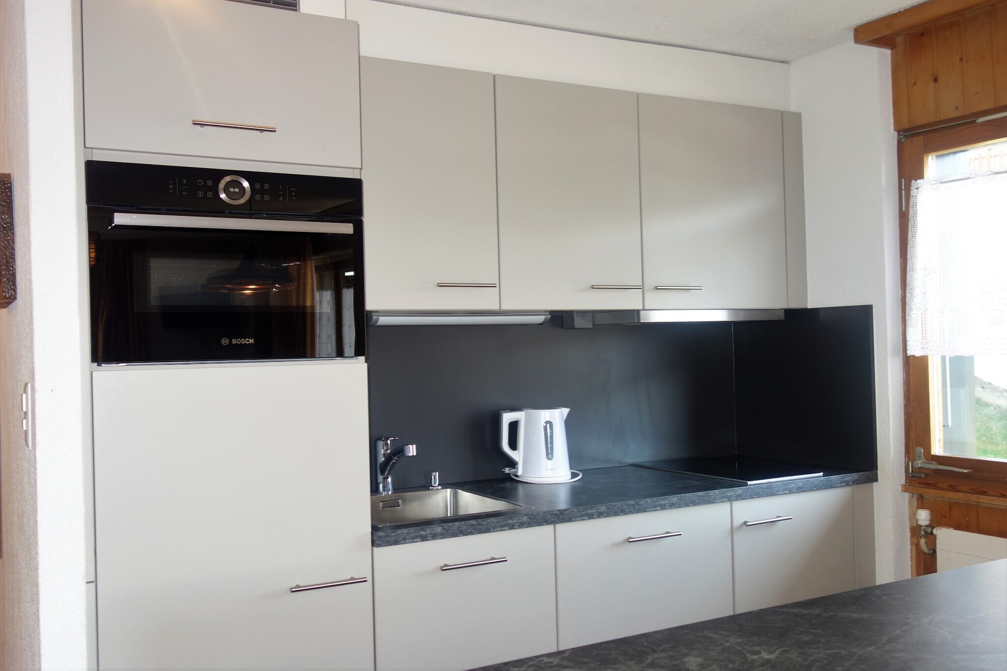 On the 2nd floor: (Living room(double sofa bed(140 x 200 cm), TV(cable, satellite), dining table, seating area), open kitchen(hob(ceramic), electric kettle, coffee machine(espresso), oven, microwave, dishwasher, fridge-freezer, Juicer, electric hot plates, dishes and cutlery(Bowls, chopsticks, plates, cups, etc.)), bedroom(double bed(160 x 200 cm)), bedroom(single bed(90 x 200 cm), single bed(90 x 200 cm)), bedroom(single bed(90 x 200 cm), bunk bed(90 x 200 cm)), bathroom(bath tub, toilet), bathroom(shower, washbasin, toilet), Internet access)\n\nski storage, washing machine, balcony, heating(central), garden furniture, parking, swimming pool(shared with other guests), lift