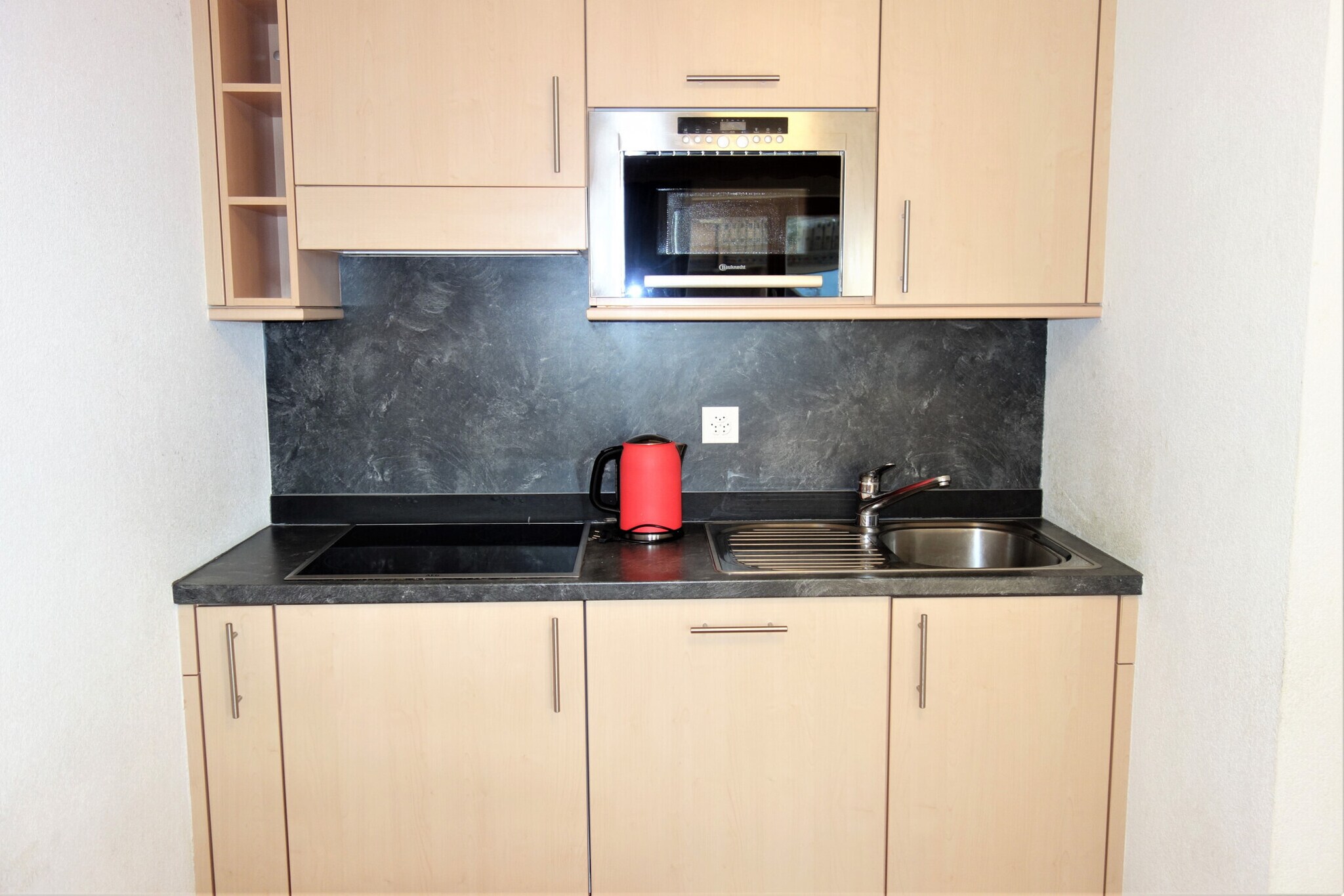 Welcome to a charming 3-star apartment located in the heart of Nendaz, Switzerland, perfectly suited for up to 6 guests. Just steps from the village center and only 100 meters from the cable cars, this cozy retreat offers the ideal ski-in/ski-out experience for your alpine getaway.

This 39 m² apartment features a bright living room with a balcony showcasing stunning valley views, flat-screen cable TV, and complimentary WiFi. The open kitchen is fully equipped with a fridge, microwave, dishwasher, and filter coffee machine, making meal preparation simple and enjoyable. The comfortable sleeping arrangements include a sofa bed in the living room, two single beds in the bedroom, and additional bunk beds in the hall.

Guests can take advantage of convenient amenities such as a sauna (extra charge), laundry facilities, ski room, and an outdoor parking space (subject to availability). Pets are welcome, making this an ideal spot for a memorable Swiss Alps vacation with family or friends.