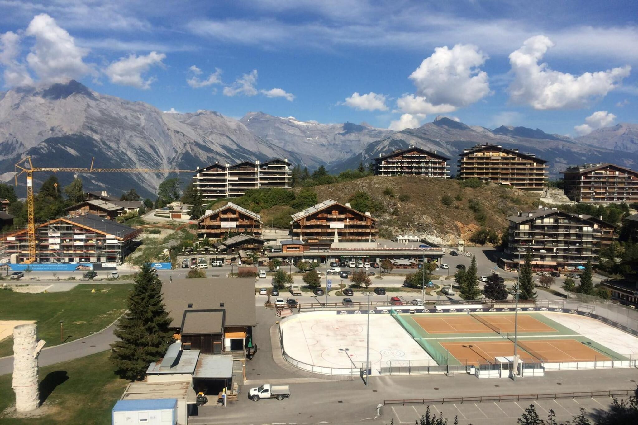 Ground floor: (Living room(double sofa bed, bunk bed, TV(flatscreen, satellite), dining table, seating area), open kitchen(hob(electric), electric kettle, toaster, coffee machine, oven, microwave, fridge-freezer, dishes and cutlery), bathroom(shower, toilet))\n\nski storage, washing machine, balcony, heating(electric), garden furniture, lift