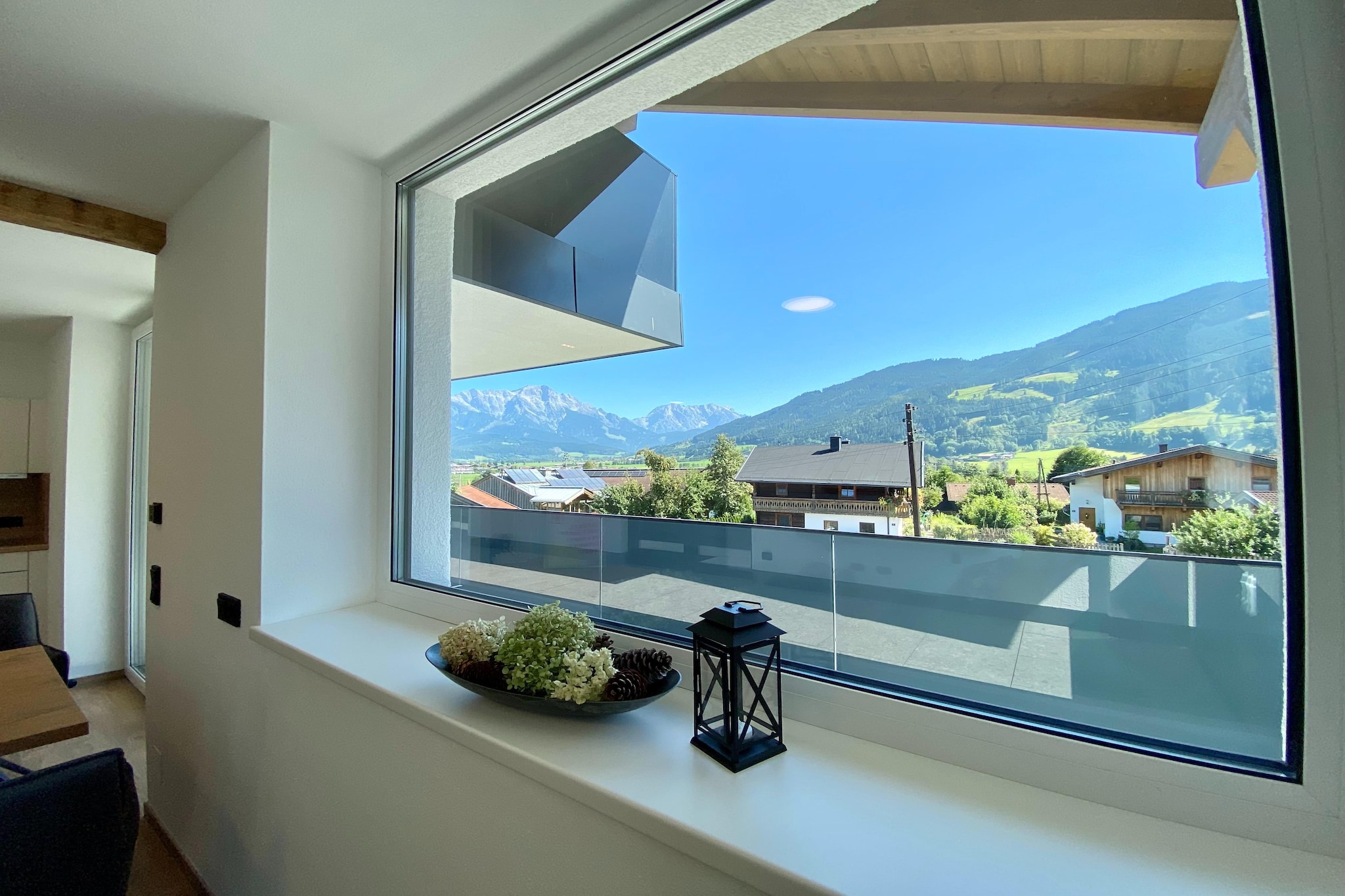 On the 1st floor: (open kitchen(electric kettle, toaster, cooker, hood, coffee machine, espresso machine, oven, dishwasher, fridge-freezer), Living/diningroom(double sofa bed, TV, dining table, seating area, balcony), bedroom(double bed(boxspring), balcony), bathroom(shower(walk-in shower), washbasin, toilet), balcony, baby crib(free))\n\nstorage(washing machine), carport, parking