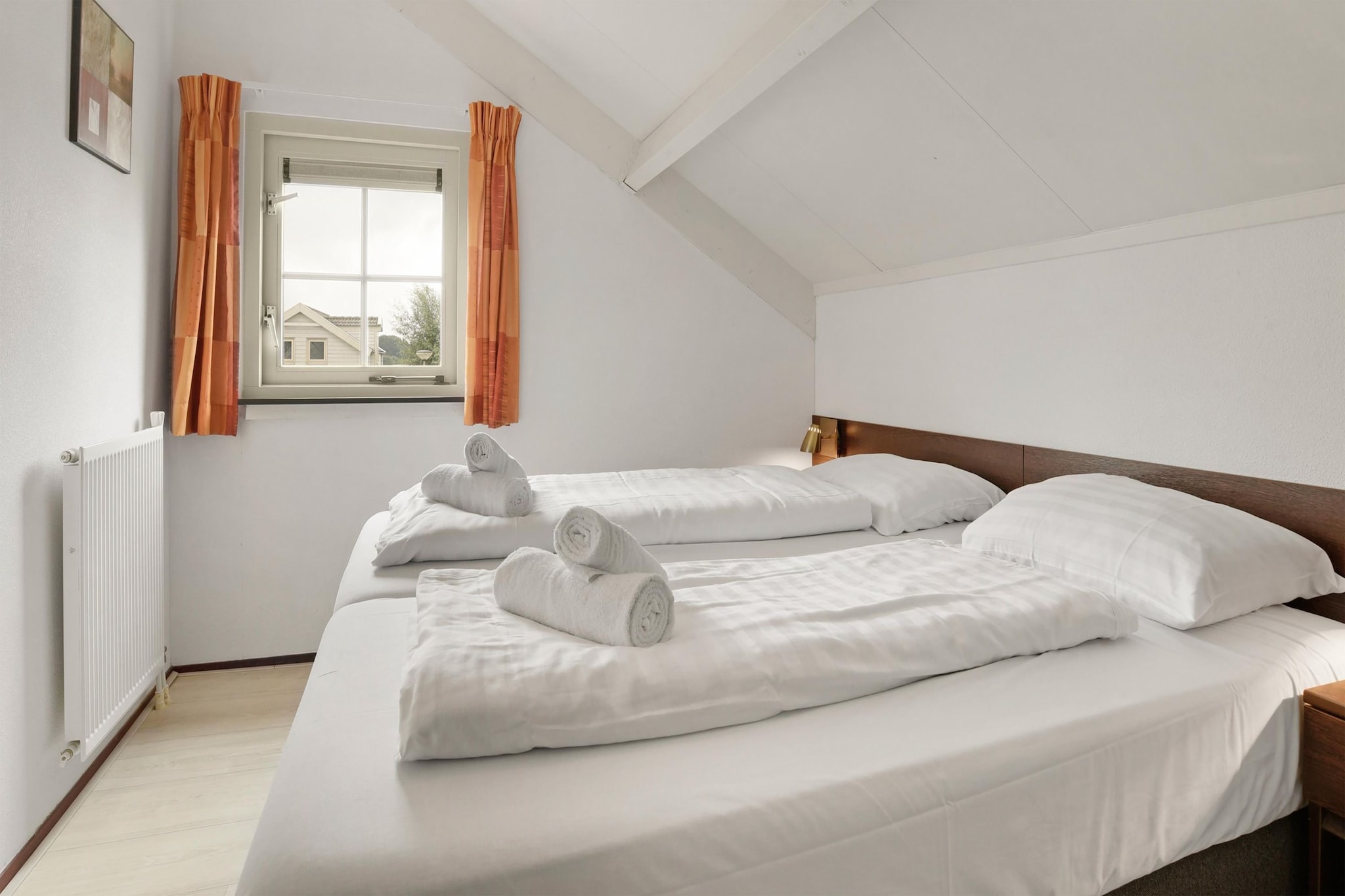 Ground floor: (hallway, Living room(TV, dining table, seating area), open kitchen(electric kettle, cooker(gas), coffee machine(cups), coffee machine(filter), combination microwave, dishwasher, fridge), toilet)\n\nOn the 1st floor: (bedroom(single bed, single bed), bedroom(single bed, single bed), bedroom(double bed), bathroom(shower, washbasin, toilet))\n\njetty, washing machine, garden doors, terrace, garden, garden furniture, parking, children\'s bed, high chair