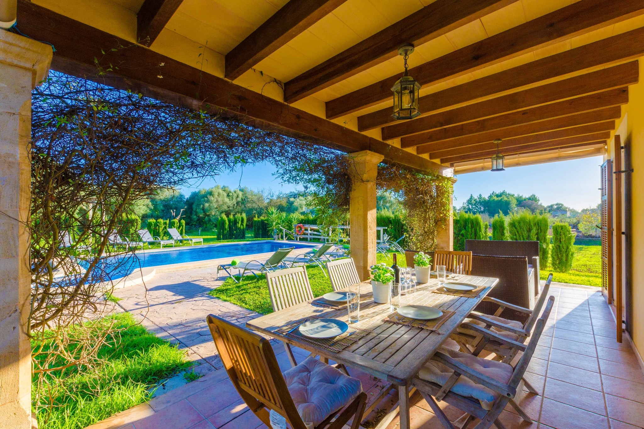 The property is completely fenced and boasts a large garden area with lawn, trees and plants. The terrace features a beautiful chlorine pool of 7 x 4 metres with a water depth that goes from 1.5 to 1.9 metres, where you can cool down. There also are 10 sun loungers where you can relax while admiring the views to the fields. The parasols will be perfect to enjoy a good reading under the shade. You can organise exciting matches of tennis table with your family or friends. You will find a barbecue and a table with chairs under the porch so that you can enjoy your evenings alfresco.
The finca is completely fenced and has a huge garden area with lawn, plants and trees. On the terrace there is a beautiful chlorine pool, 7m x 4m and a depth of 1.5m to 1.9m, where you can cool off, as well as 10 sunbeds so you can relax and enjoy the views of the countryside. There are also umbrellas if you prefer the shade while reading a book. Thanks to the ping-pong table you can organise exciting tournaments with your family or friends. There is a barbecue, a table and chairs under the porch so you can organise outdoor dinners.
Inside, the spacious living-dining room is equipped with three comfortable sofas to watch Astra TV (mostly German channels and a few in English and French) or a DVD movie. The kitchen has everything you need: toaster, microwave, dishwasher, electric oven, ceramic hob, fridge and much more. There is also a washing machine, tumble dryer, iron and ironing board. There are a total of 4 bedrooms so it is ideal for families or groups of friends. On the ground floor, you will find one of them with a double bed, as well as a bathroom with bathtub. Going upstairs, you will find another bathroom with bathtub and 3 other bedrooms: one with double bed, en suite bathroom with bathtub and direct access to the terrace and two with two single beds. All 4 bedrooms have wardrobe and air conditioning. We can prepare a cot and a highchair if you are travelling with your baby.
At 3 km from the house you will find Inca, a village in the centre of the island, quiet and with shops where you can find everything you need for your stay, such as supermarkets, bars, Mallorcan restaurants, shops, bakeries and its well-known market every Thursday, which has been held for more than 7 centuries. The most interesting places to visit are its three churches, dating back to the 13th century, its monastery of San Bartolomé or the hermitage of Santa Magdalena, located on the top of a small mountain declared of natural interest, which is also an excellent viewpoint over the whole island. The nearest beaches are in Puerto de Alcúdia or Puerto de Pollença, which are half an hour's drive away. Consult the advertiser for possible charges. Pets are not allowed. The holding of events is forbidden. There is exterior parking for 4 cars.
Distances
Beach: 25 km - Alcúdia
Airport: 40 km - Son Sant Joan
Golf course: 22 km - Pollença
Town: 3 km - Inca
Train station: 4.5 km - Inca
Bus stop: 3.2 km - Av. Jaime I
Ferry: 25 km - Puerto de Alcúdia
Hospital: 2.6 km - Hospital Comarcal d'Inca
Tourist license: ETV/5857Single Rental Registry: ESFCTU000007011000342741000000000000000000000ET/58579The Ecotasa (tourist tax) must be paid cash on site when checking in. The amount varies between 0.55€/night and guest during the low season and 2.2€/night and guest during the high season. The tax is reduced by half from the 9th day of your stay. All guests have to pay the Ecotasa, except people under 16 years. You will have to pay the deposit amount at the arrival to the owner.