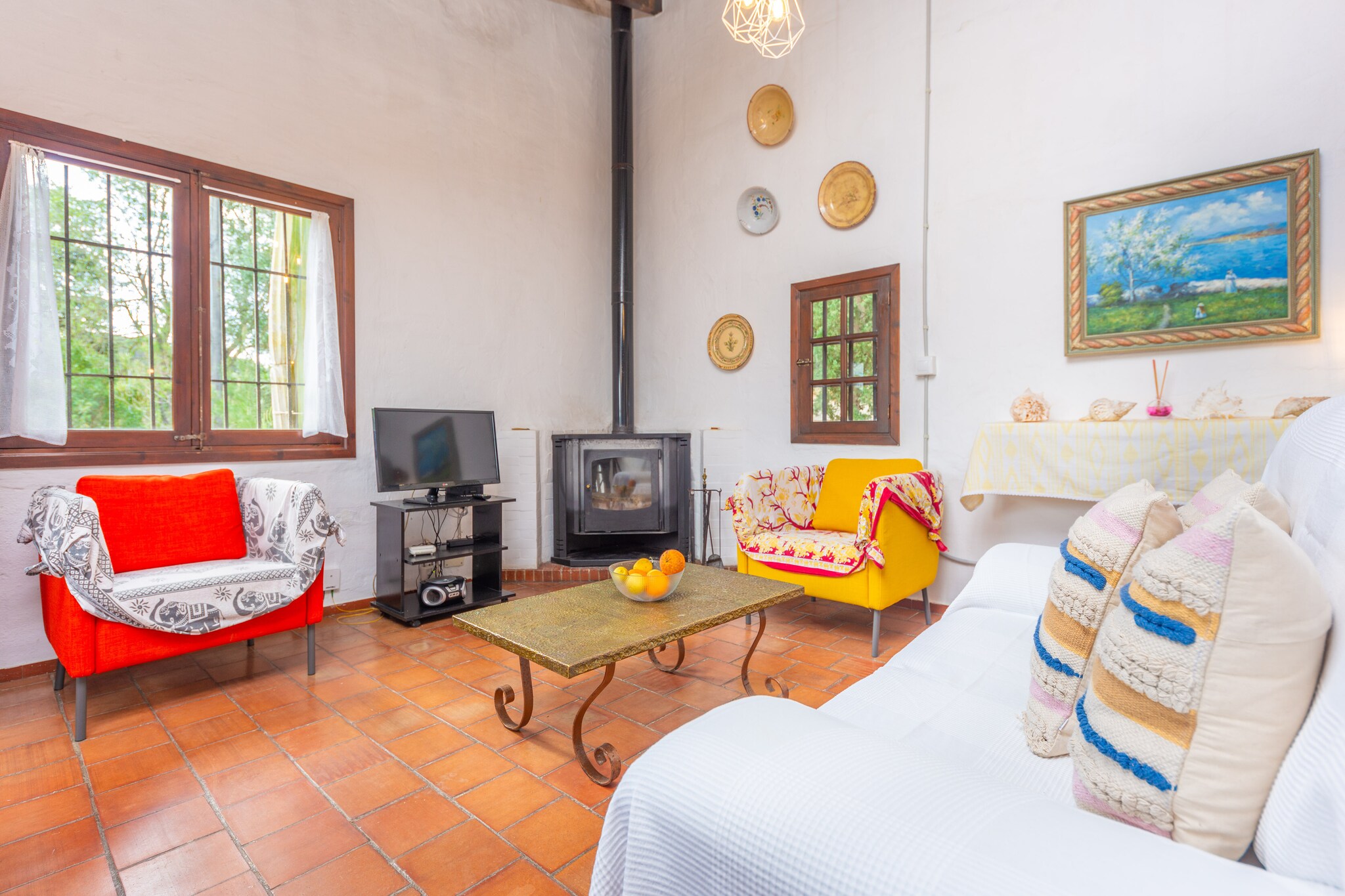 The property features 2700 m2 around the house and the pool area with a forest and Mediterranean garden. The chlorine 7 x 5 metres pool has a depth from 1.8 to 2.2 metres. You will find an area with 6 sun loungers to relax sunbathing by the pool. A mobile gas barbecue is available so that you can cook outdoors. There is a wide variety of fruit trees in the garden, like orange trees, fig trees, medlar trees,...that you can taste when it is their season. In front of the house there is a terrace with a thatched roof, furnished with a table and chairs as well as a sofa in a chill out way. This is the perfect place to relax while having breakfast or reading a book.
The house has a constructed area of 110 m2 and is ideal for families or small groups of friends, as it has two double bedrooms. One of them has two single beds and air conditioning, the second one, located in a loft, has a double bed and air conditioning as well. Both rooms have wardrobes and are spacious, so you can have 2 cots and 2 high chairs if you need them. The bathroom that serves the whole house has a shower. The living room invites you to watch TV in the comfortable armchairs and sofa or to play a game of board games with the little ones. It opens onto the dining room and also to the kitchen, which has everything you need to cook your best recipes, including gas cooker, toaster, microwave, coffee maker, electric oven and nice views to the outside. Of course, there is a washing machine, iron and ironing board.
The location of this property is perfect since you will reach any point in the island in little time. However, you will need a car because the nearest bus stop is 650 metres away, in Campanet. You will find supermarket, restaurants, pharmacy, etc in the village. The nearest hospital is 8 km away, in Inca. In this little city you will find a great variety of shops and all kinds of restaurants (fresh fish, high quality meat, Italian, tasting menus, traditional Mallorcan food restaurants,...). The street market in In ca takes place every Thursday and the town turns into a lively place. Fantastic beaches like Playa de Muro, Can Picafort, Puerto de Alcúdia, Playa de Formentor or Puerto de Pollença can be reached in about 20 minutes by car. You also can visit Cala Sant Vicent and the village of Pollensa where you can climb the more than 365 steps till the chapel of the so called Calvari! Landscape views from there are really worthy! Consult the advertiser for possible charges. Pets are not allowed. The holding of events is forbidden. There is exterior parking for 6 cars.
Distances
Beach: 17.4 km - Puerto de Alcúdia
Airport: 46.2 km - Son Sant Joan
Golf course: 15.1 km - Golf Alcanada
Town: 0.65 km - Campanet
Train station: 8.9 km - Sa Pobla
Bus stop: 0.65 km - Campanet
Ferry: 20 km - Puerto de Alcúdia
Hospital: 6 km - Hospital Comarcal de Inca
Tourist license: ETV/6459Single Rental Registry: ESFCTU00000702200019894800000000000000000000ETV/64592