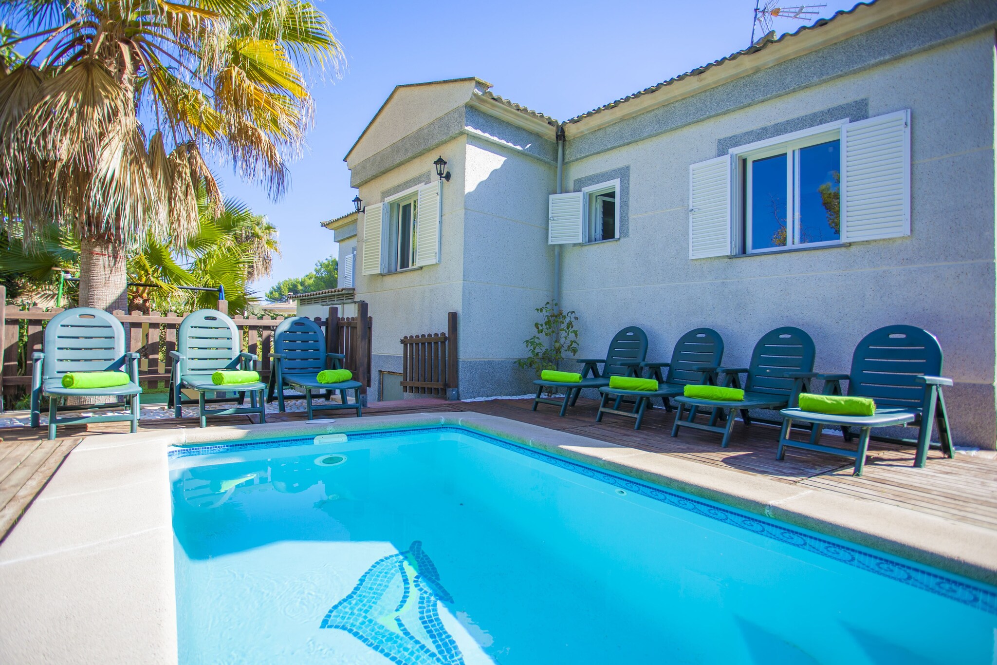 The exterior of the house is beautiful, with a 5 x 2 m large chlorine swimming pool with a depth ranging from 0.5 to 1.2 m, 4 loungers and the cozy playground area for the kids. For the lovers of summer open air meetings, there is one fully equipped porch with a fixed barbecue.
The house with 220 m2 is distibuted over 2 floors. It has 5 bedrooms; three of them on the ground floor with double bed (one with en suite bathroom with bathtub), and two on the 1st floor; one with two single beds, and one with one double bed, air conditioning, and bathroom with shower. One cot and one high chair are available on request. In addition there is 1 bathroom on the ground floor.
In the spacious, modern living room you can find one large sofa, bedside table, TV and wood stove. The dining area, in the same space, is equipped with table and chairsand. Both have lots of outside light and air conditioning. The separated kitchen with gas, has all the necessary cooking utensils. A washing machine, iron and ironing board are also available.
The area of Sa Marina, is a very quiet area surrounded by local people. In the area you can make excursions to Cala Voquers, La Victoria, etc. In a few kilometers you will also find Puerto Pollensa, Formentor, Puerto de Alcudia, etc.
In the Port of Alcudia and Port of Pollensa are restaurants for all tastes; fresh fish, good meat, pizza and pasta, sushi, tapas, tasting menus and Majorcan cuisine.
The old town of Alcudia, with its cobblestone streets, squares, the church and the walls surrounding the city, worth a visit. Tuesdays and Sundays are market days in Alcudia and the town is transformed into a bustling and lively place. Do not forget to visit the highly recommended Roman ruins.
By car or bus you can reach very easily other areas like Playa de Muro, Can Picafort, Playa de Formentor, Cala San Vicente. The town of Pollensa and its small church on top of the hill (Calvari) can be a good option for a half day excursion. To reach the Calvari with its magnificent views, you have to climb a staircase with 365 steps.
The swimming pool will be available from 01/05 to 31/10. Swimming pool with children protection. Note: This accommodation is intended for families and guests over 25 years old who are looking for a peaceful stay. Bookings for parties or celebrations are not accepted. A copy of the identification document of all guests will be required to confirm the reservation. Consult the advertiser for possible charges. Pets are not allowed. The holding of events is forbidden.
Distances
Beach: 0.3 km - Sa Marina
Airport: 60 km - Son Sant Joan
Golf course: 7.5 km - Alcanada
Town: 2.3 km - Alcúdia
Train station: 12 km - Sa Pobla
Bus stop: 0.45 km - Carretera Port de Pollença-Alcúdia
Ferry: 8 km - Port d'Alcúdia
Hospital: 24.6 km - Hospital Comarcal d'inca
Tourist license: ETV/4706Single Rental Registry: ESFCTU00000704300003337400000000000000000000ETV/47063The Ecotasa (tourist tax) must be paid cash on site when checking in. The amount varies between 0.55€/night and guest during the low season and 2.2€/night and guest during the high season. The tax is reduced by half from the 9th day of your stay. All guests have to pay the Ecotasa, except people under 16 years. You will have to pay the deposit amount at the arrival to the owner.Homerti - Central de Reservas CR/33