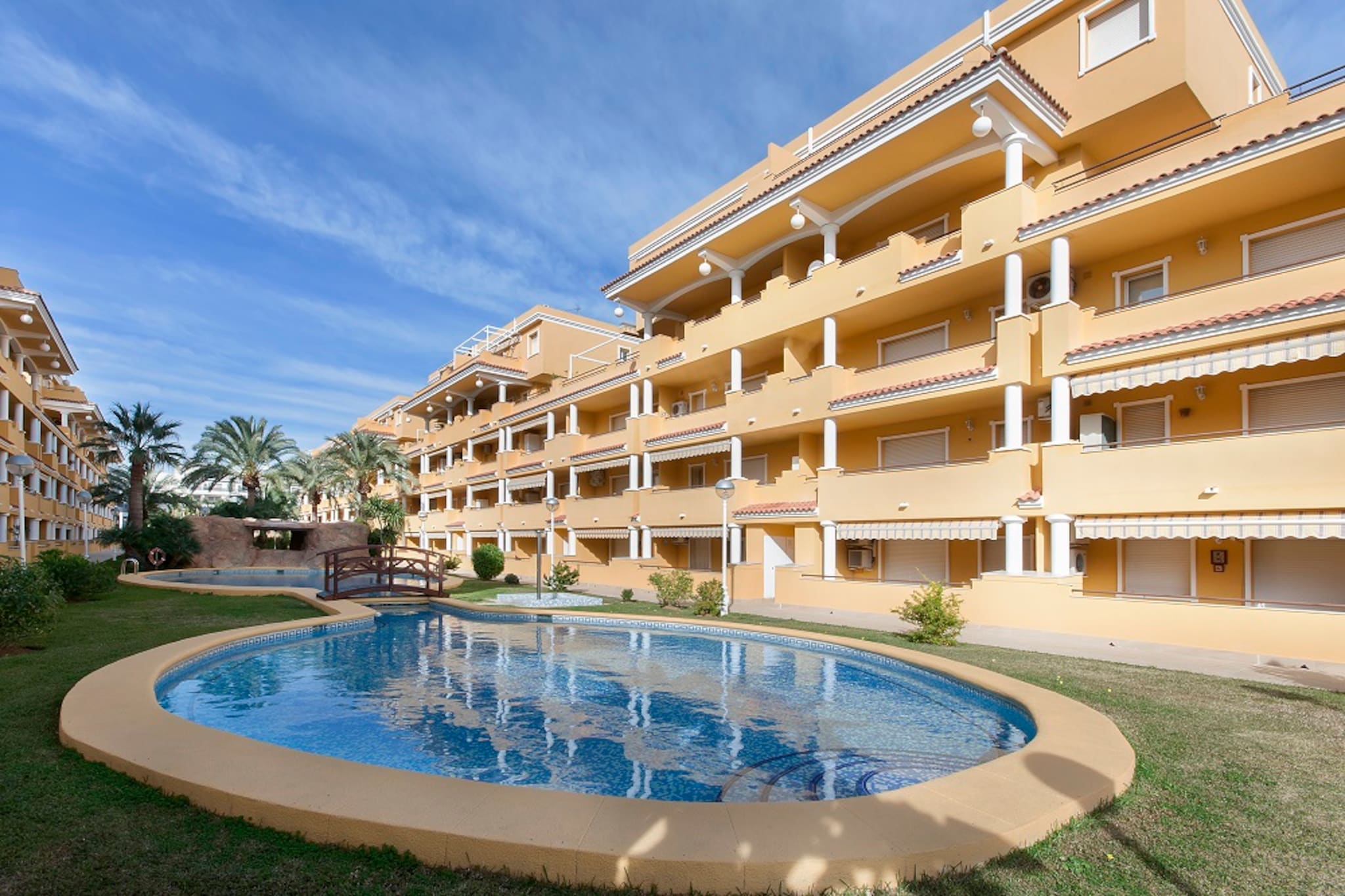 The terrace of the apartment is furnished with table and chairs so you can have breakfast enjoying the sunshine. In this fenced complex there are around 2000 m2 of communal areas: there is a lawn area where your kids will love to play and have fun while you swim in the pool or sunbathe. There are two pools and two children pools.
Inside the apartment, in the bright living-dining room you will be able to organize a meal with your family, relax on the comfy sofas or watch TV. The open kitchen is equipped with blender, coffee machine, toaster, juice maker, microwave, dishwasher, vitro, electric oven, fridge, cutlery and a lot more. There are also washing machine, iron and ironing board. There are two bedrooms: one with a double bed and one with two single beds. The two extra guests are accommodated on the sofa bed. There in one bathroom. In the living room there is an AC device that refreshes the whole apartment.
For those who prefer the sea, the beach of Leas Marines is only 350 meters away! It is a spacious and quiet beach ideal for the whole family. Nearby you will find many bars and restaurants, so you can spend the whole day at the beach with no worries. Nearby there are some places that are worth to visit: the rocky beaches of “las Rotasâ€, the marine reserve of Cabo San Antonio or the castle of Denia. You can find diving activities, trekking and cycling paths.
The pool is open from 1. June till 30. September. Consult the advertiser for possible charges. Pets are not allowed. The holding of events is forbidden. There are parking space for 1 cars in the garage. Please note that the opening and closing dates of the communal pool are subject to community regulations and may vary depending on the season, without prior notice. Updated information will be available upon your arrival.
Distances
Beach: 0.45 km - Les Marines
Airport: 115 km - Valencia, Manises
Golf course: 17 km - Oliva Nova
Town: 1 km - Denia
Train station: 2 km - Denia
Bus stop: 0.15 km - Carretera Les Marines
Ferry: 1 km - Denia
Hospital: 5 km - Hospital Marina Salud de Denia
Tourist license: CV-VUT05117002-ASingle Rental Registry: ESFCTU0000030450005554230000000000000CV-VUT0517002-A8