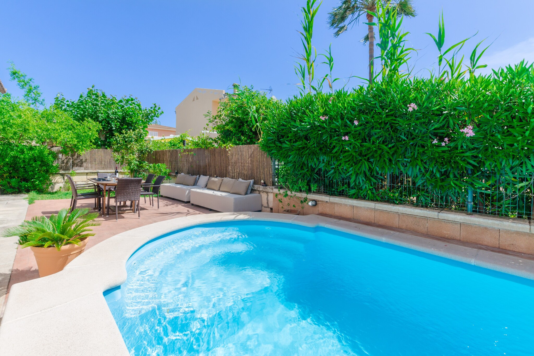 Have a morning swim in the 6m x 3m chlorine pool with a depth ranging from 1m to 1.5m. Up to five sun loungers are perfect for getting tanned. Next to the pool, a breakfast terrace can be used also for a barbecue in the evening. At the other side, a chill-out corner invites you to have a glass of wine with your loved ones. The plot is fenced and there are direct neighbors. 

This home offers accommodation on two floors and 130m2 with three cozy bedrooms with wardrobe on the first floor; two with one double bed and one with two twin beds. Windows allow a lot of light to come in. A cot and a high chair for our youngest guests can be provided upon request. This house offers two bathrooms, one on each floor, with bathtub or shower. 

Have long table talks in the sitting-dining room, maybe while the children are watching a film on the satellite-TV. There’s a fully-equipped kitchen with vitro hob so you will be able to prepare your favorite meals. The laundry features a washer, iron and ironing board. There’s A/C in the living area and in the hall on the first floor. 

If you like the beach and the sea, Puerto de Alcúdia is a good place for water sports, basking in the sun and enjoying the crystal clear waters. It doesn’t matter whether you like to go shopping, are a foodie or travel with children – this town has everything, especially during the summer season. A 10 minutes’ drive takes you to Alcúdia’s old town where you can visit the colorful market every Saturday and Tuesday. The fine grained sand beach is just 10 minutes walking from the house and it is just perfect for families with children as the swell is moderate. 

In June, July and August the changeover day is on Saturday. Consult the advertiser for possible charges. Pets are not allowed. The holding of events is forbidden. There is exterior parking for 1 cars.  
Distances
Beach: 0.5 km - Port d'Alcudia
Airport: 60 km - Son Sant Joan
Golf course: 2.5 km - Golf Alcanada
Town: 3.5 km - Alcudia
Train station: 13 km - Estació de Sa Pobla
Bus stop: 0.3 km - Av. de S'Albufera, Port d'Alcudia
Ferry: 2 km - Port d'Alcudia
Hospital: 1 km - Hospital Juaneda Muro
Tourist license: ETV/8926Single Rental Registry: ESFCTU00000701100081300500000000000000000000ETV/89263There's a mandatory tourist tax in Balearic Islands, called Ecotasa. All guests, except people under 16 years, have to pay this tax. The amount varies between 0.55€/night and guest during the low season and 2.2€/night and guest during  the high season .The tax is reduced by half from the 9th day for your stay. Homerti - Central de Reservas CR/33