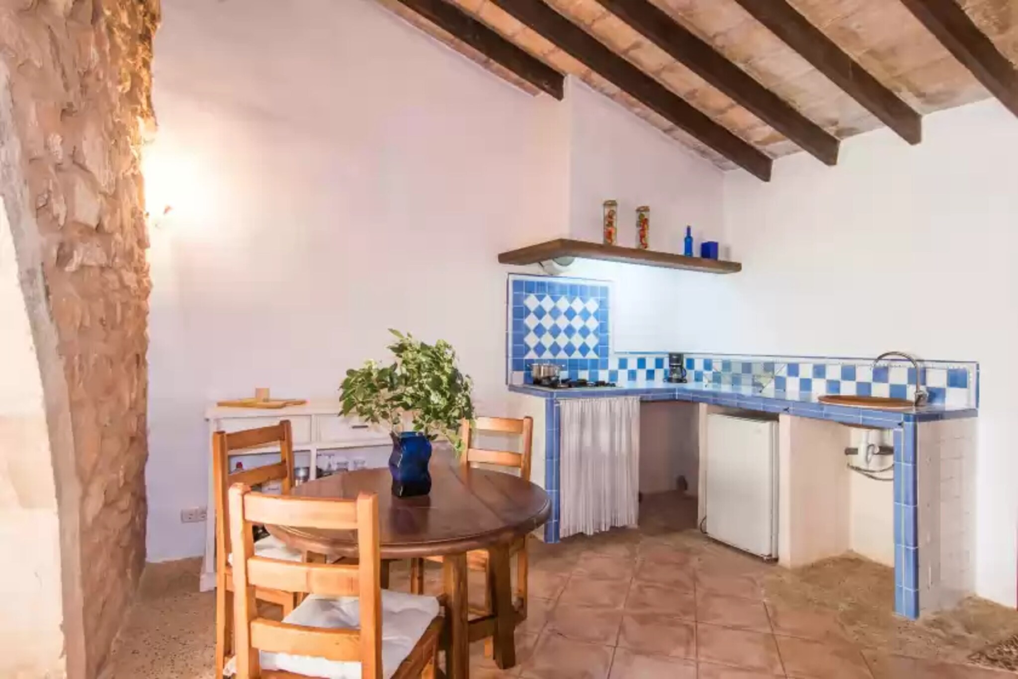 The first historical record of this estate is dated back to the 19th Century. It has been carefully reformed and features a 10m x 4m chlorine shared pool with a depth ranging from 1.1m to 1.8m. Kids will enjoy the childrens' pool (depth: 0.45m). Both pools as well as the terraces, loungers, parasols, the exterior shower and the barbecue are shared with de neighbors. The finca sets in a plot of 32000m2 which is fenced. 

The estate offers several two- and four-bed flats, and Rafal Nord is a 50m2 sized apartment for two people. It is on the ground floor and has a terrace with two sun loungers and a table, perfect for a romantic dinner. The studio has a living-dining room with kitchenette, open to the bedroom with two single beds side by side and wardrobe. The TV, although small, has satellite TV. The kitchenette is very simply equipped, offering a gas hob, fridge, coffee maker and basic utensils for preparing snacks. The bathroom is en-suite, and has a shower as well as a washbasin and hairdryer. A cot and high chair are available on request. 

The estate is set in the North-East of the island, 15 km from Son Serra de Marina Natural Beach. A car is necessary to explore the beautiful north coast and beaches like Colonia de Sant Pere, Playa de Muro and Can Picafort. Enjoy genuine island life in Sant LlorenÃ§ des Cardassar and Petra, try our tasty cuisine in one of the cellers or take a walk through the cobbled streets. The city of Manacor offers more amenities like supermarkets, shops and more restaurants. 

There's no washing machine, but laundry service upon an extra cost on site is offered. Consult the advertiser for possible charges. Pets are not allowed. The holding of events is forbidden. There is exterior parking for 2 cars.  Please note that the opening and closing dates of the communal pool are subject to community regulations and may vary depending on the season, without prior notice. Updated information will be available upon your arrival.
Distances
Beach: 15.4 km - Son Serra de Marina
Airport: 48.1 km - Aeroport de Son Sant Joan
Golf course: 19.2 km - Pula Golf
Town: 8.4 km - Manacor
Train station: 9 km - EstaciÃ³ de Manacor
Bus stop: 8.4 km - Carrer de Conilles, Manacor
Ferry: 39.9 km - Port d'Alcudia
Hospital: 8 km - Hospital de Manacor
Tourist license: AG/97The Ecotasa (tourist tax) must be paid cash on site when checking in. The amount varies between 0.55â‚¬/night and guest during the low season and 2.2â‚¬/night and guest during  the high season. The tax is reduced by half from the 9th day of your stay. All guests have to pay the Ecotasa, except people under 16 years.  Extra Cot (January - December): 7 EUR/Night (optional) <br> <br />