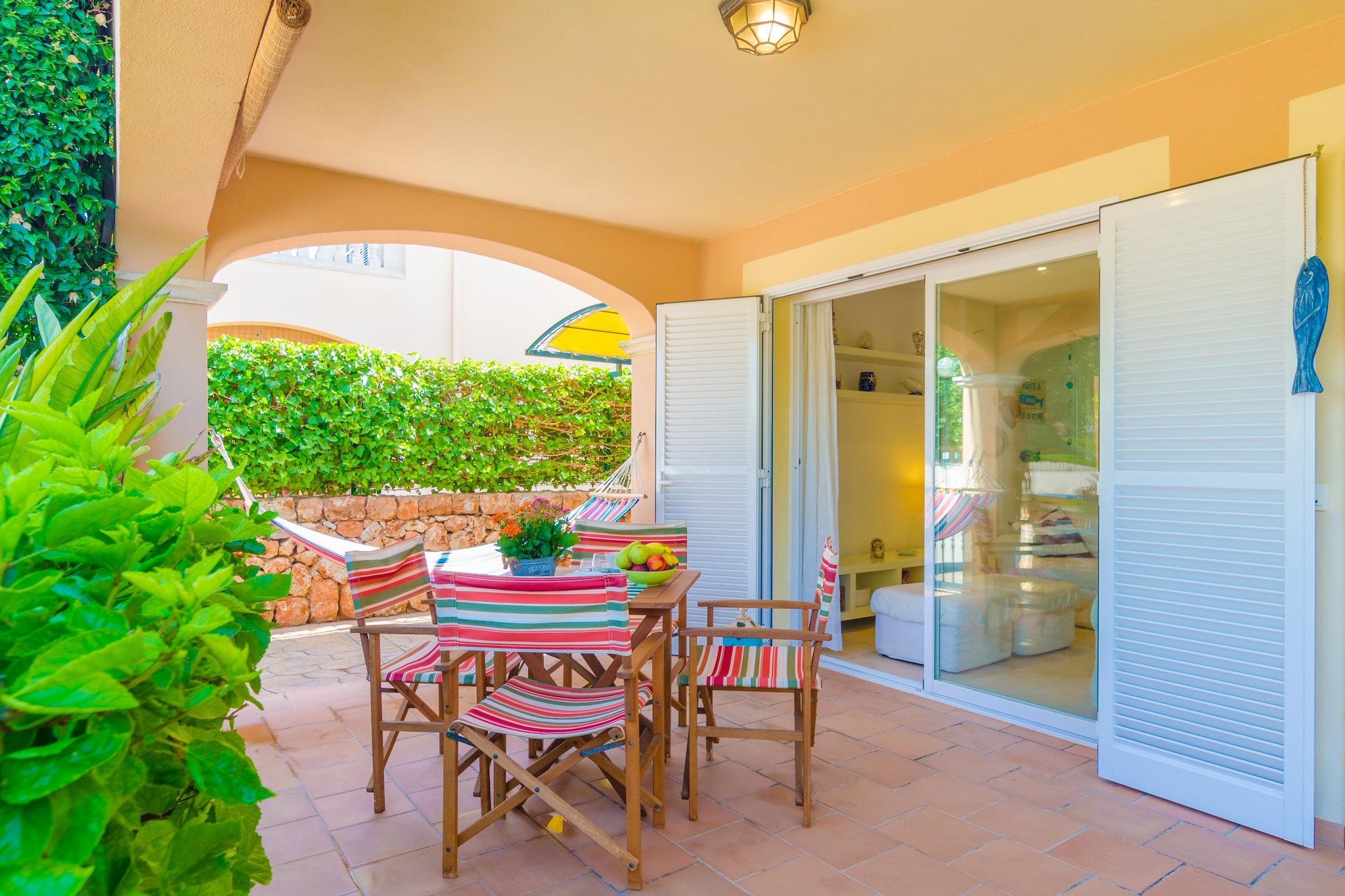 The outside spaces around the house invite to spend time outdoors enjoying the good Majorcan weather. You can have breakfast or a drink at the porch by the living room, or simply relax reading a good book while enjoying the refreshing breeze from the sea. At the back of the house, by the kitchen, an outside dining area where you can have lunch or dinner out doors and enjoy fabulous barbecues under the awning protection. On the first floor you will find the ideal place for sunbathing or admiring the stars at night. The property is fenced and there are neighbours around.
The two storey 120 m2 house has a comfortable, refreshing and Mediterranean style which will make you feel at home. On the ground floor you will find the living and dining room where you can watch TV or simply have a rest on the sofa while refreshing with the air-conditioning. Then the beautiful and Mediterranean dining area with capacity for 4 people. The kitchen is independent and fully equipped, with a ceramic hob and dishwasher, and also a table for 4 people. From the kitchen we have access to the back terrace of the house. It also has a laundry area with a washing machine, a tumble dryer, an iron and an ironing board. A shower bathroom completes this floor. Upstairs you will find the three bedrooms. Two of them feature a double bed and the last one has twin beds. All are air-conditioned and with a closet. From one of the double bed bedrooms we have access to the first floor terrace. Another shower bathroom completes this floor. We can prepare a cot and a high chair if you are coming with a baby.
This house is located in Sa Ràpita, in the 3rd line from the sea and very close to the beach, only 1.5 km away. In addition to the beach of the village you can also visit the amazing and paradisaical beach of Es Trenc, a wonderful turquoise waters and white sandy beach where you will enjoy really a beach day in a virgin environment. Other beautiful close beaches are Es Molí de s’Estany, Ses Covetes and s’Arenal d'en Tem. You are going to find all basic services for an independent stay in the village, including, bars, restaurants and supermarkets. Note: This accommodation is intended for families and guests over 30 years old who are looking for a peaceful stay. Bookings for parties or celebrations are not accepted. A copy of the identification document of all guests will be required to confirm the reservation. Consult the advertiser for possible charges. Pets are not allowed. The holding of events is forbidden. There is exterior parking for 1 cars.
Distances
Beach: 1.5 km - Platja de Sa Ràpita
Airport: 35.3 km - Son Sant Joan, Palma
Golf course: 23.3 km - Golf Son Antem, Llucmajor
Town: 0.001 km - Sa Ràpita
Train station: 37.6 km - Plaça de l'Estació, Manacor
Bus stop: 0.250 km - Av. Miramar, Sa Ràpita
Ferry: 43.1 km - Port de Palma
Hospital: 40.5 km - Hospital de Manacor
Guests are kindly required to dispose of all rubbish and ensure the property is properly tidied before departure. Should this not be the case, a charge of €90 will be deducted from the security deposit. Tourist license: ETV/12643Single Rental Registry: ESFCTU00000700800102985600000000000000000000000126430There's a mandatory tourist tax in Balearic Islands, called Ecotasa. All guests, except people under 16 years, have to pay this tax. The amount varies between 0.55€/night and guest during the low season and 2.2€/night and guest during the high season .The tax is reduced by half from the 9th day for your stay. Homerti - Central de Reservas CR/33