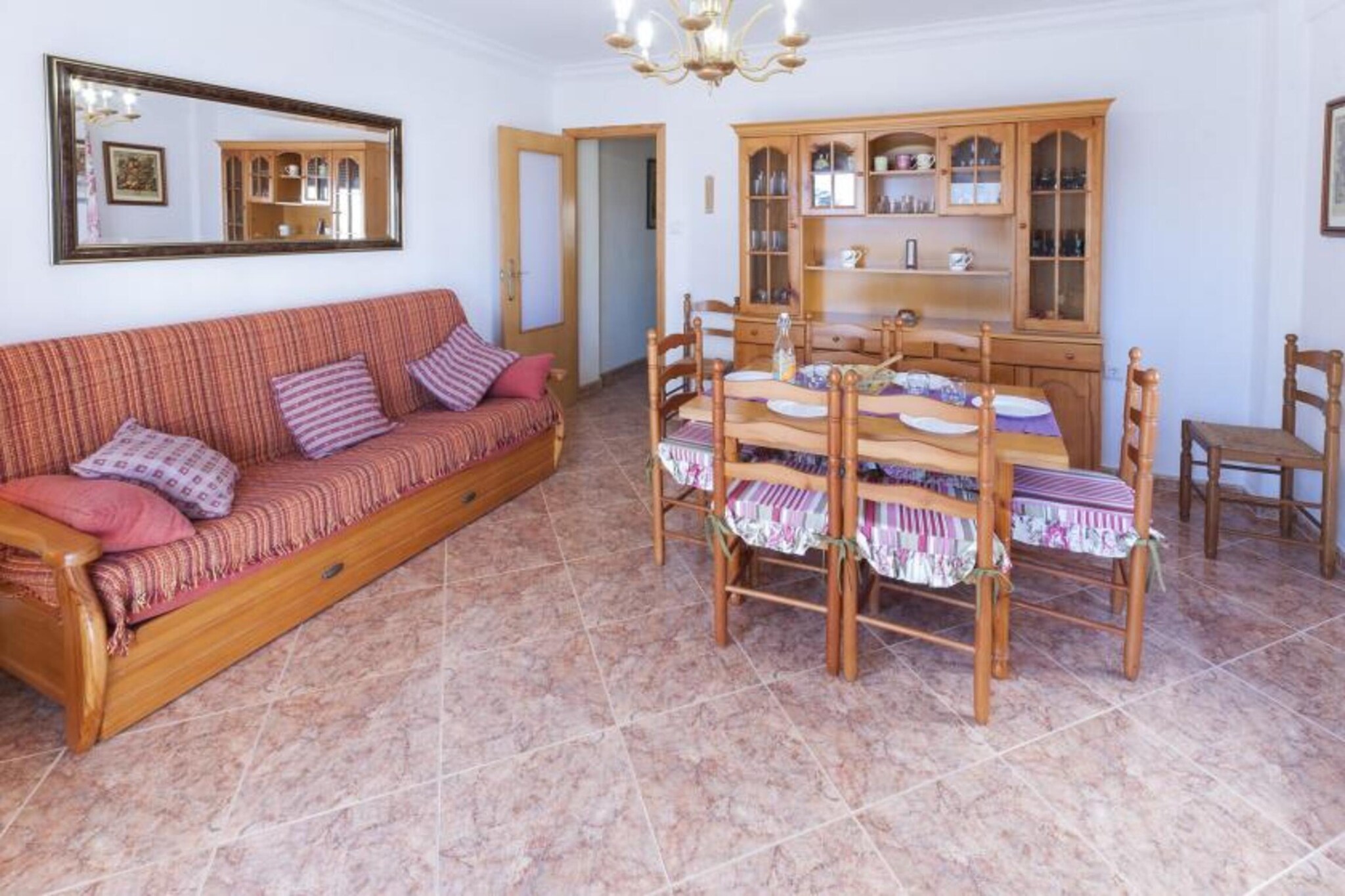 With town and sea views, the terrace of this apartment is perfect to enjoy a good breakfast together with the morning fresh breeze and the first sun beams. If you feel like swimming, just take your mist funny towels, some appetisers and walk 250 metres to get to the beach.
This apartment presents a spacious, luminous and airy living-dining room, ideal to watch a film while resting or have lunch all together. The kitchen, with a ceramic hob, has a long shape with countertops on each side to it is very helpful to prepare your recipes. The bathroom is large and counts with a shower. There are three bedrooms with a closet each one to rest in the apartament. One has a double bed, and the other two have two twin beds each. If you are travelling with your baby we can prepare a cot and a high chair. There is one fan available, as well as a washer, an iron and an ironing board.
This apartment in Playa de GandÃa has all services nearby. The village counts with a marvellous fine sandy beach and also a great variety of ways to enjoy culture and nature. For instance, you can make an excursion to Ullal de L'Estany, one of the springs that nourish the marsh in Gandia. The Nort beach is 3 km long and it offers sun loungers and sunshades rental and a great promenade full of bars and restaurants. The beach of l'Ahuir is much quieter and an important refuge for local plants and animals. The dunes of Gandia can be found there. Note: This accommodation is intended for families and guests over 27 years old who are looking for a peaceful stay. Bookings for parties or celebrations are not accepted. A copy of the identification document of all guests will be required to confirm the reservation. Consult the advertiser for possible charges. Please note that the keys to access the property will be in a mailbox at a nearby petrol station. You will receive the coordinates of the petrol station and the details of the mailbox three days prior to your arrival. Pets are not allowed. The holding of events is forbidden.
Distances
Beach: 0.25 km - Playa de Gandia
Airport: 76 km - Valencia
Golf course: 19 km - Oliva Nova
Town: 0.01 km - Playa de Gandia
Train station: 2 km - Grau de Gandia
Bus stop: 0.3 km - Playa de Gandia
Ferry: 53 km - Denia
Hospital: 8 km - Gandia
Tourist license: CV-VUT0042755-VSingle Rental Registry: ESFCTU0000460650002163340000000000000CV-VUT0042755-V5