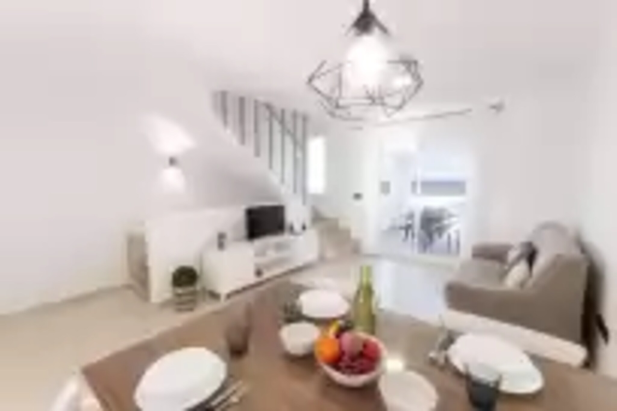 If you love the sea and modern accommodations this is the best house to stay. The front terrace is basically over the sea sand and the inside offers a comfortable modernity. You can enjoy your meals at the front terrace each day, admiring the sea and the golden sand. However, you also have the back terrace where you also can spend the nicest family moments.

Inside, you'll find an airy and relaxing room combining the living area -with TV-, the dining and the kitchen. This offers an induction top, all you need to cook as if you were at home, and an air conditioner to refresh this entire room. Climbing the stairs you'll find the bathroom of the house, with a shower, and two bedrooms with a closet and a fan each. One of them offers a double bed, space for a baby cot and access to a balcony with views to the sea. The second has a trundle bed. There are a washing machine, an iron, an ironing board and a high-chair for your baby.

This terraced house offers direct access to the beach of La Devesa, just a few steps away. Imagine yourselves reaching the beach with just a towel  to bask in the sun and swim because you can return to the house to fetch some appetisers and drinks. The area of Oliva Nova is also perfect since the golf course is just 2.8 km away and there are lots of services like bars, restaurants, etc, around. Note: This accommodation is intended for families and guests over 27 years old who are looking for a peaceful stay. Bookings for parties or celebrations are not accepted. A copy of the identification document of all guests will be required to confirm the reservation.  Consult the advertiser for possible charges. Pets are not allowed. The holding of events is forbidden. 
Distances
Beach: 0.020 km - Platja La Devesa
Airport: 98.9 km - Valencia
Golf course: 2.8 km - Golf Oliva Nova
Town: 0 km - Oliva Nova
Train station: 10.3 km - Oliva 
Bus stop: 10.3 km - Oliva
Ferry: 17.5 km - Puerto de Denia
Hospital: 16.2 km - Hospital Comarcal Francesc de Borja
Tourist license: CV-VUT0048563-VYou will have to pay the deposit amount at the arrival to the owner.