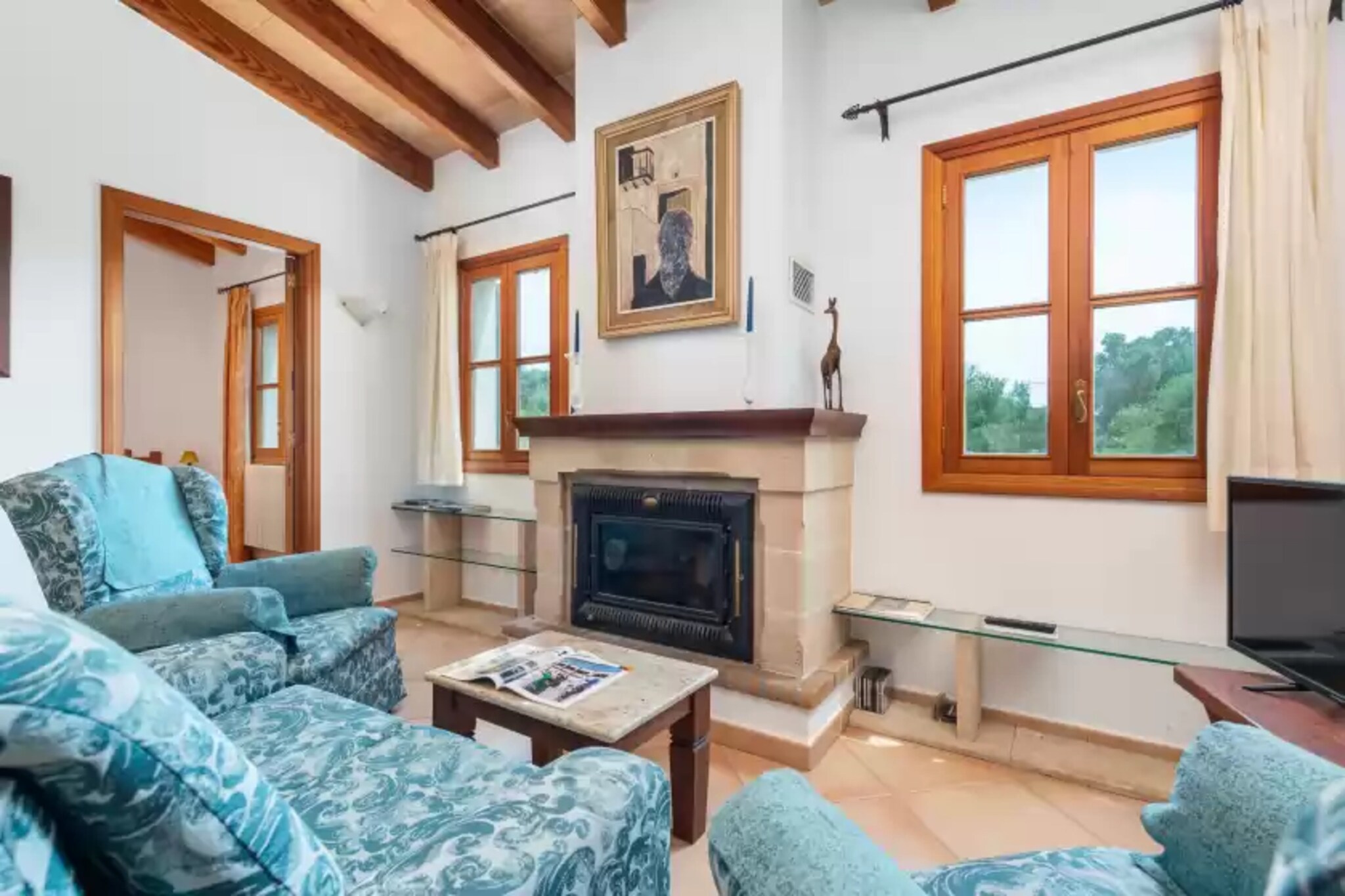 This charming country house in the middle of a bucolic setting will ensure your well-deserved rest during your vacation. The porch is perfect for family meals or barbecues, while also enjoying the beautiful views of the fields. The property is fenced and privacy is total. 

The one-storey house has a simple and comfortable style. The large Majorcan entrance leads to the living-dining room, equipped with satellite TV, a fireplace and a dining table for 4 people. The semi open kitchen has a gas stove. The separate laundry features a washing machine, iron and ironing board. To rest, the house features 2 bedrooms, both with twin beds and a wardrobe. Both bedrooms have direct access to the first of the bathrooms, with a bathtub. There is another bathroom with a shower. Finally, a baby cot, a high chair and gas central heating complete the equipment. 

The house is located in the countryside but the town, Son Servera, is only 4 km away. There you can find the basic services for an independent stay such as supermarkets, bars, restaurants, etc. The closest beach is sa Marjal  a beautiful sandy beach located 7.5 km away, although you will find other beautiful beaches in the area as well. If you like golf you can practice it on the Golf Pula course located just 5.2 km away. Consult the advertiser for possible charges. Pets are not allowed. The holding of events is forbidden. There is exterior parking for 2 cars.  There are parking space for 1 cars in the garage. 
Distances
Beach: 7.5 km - Sa Marjal
Airport: 65.8 km - Son Sant Joan
Golf course: 5.2 km - Golf Pula
Town: 4.3 km - Son Servera
Train station: 18.4 km - Manacor
Bus stop: 3.4 km - PlaÃ§a Nova Son Servera
Ferry: 40.6 km - Port d'Alcudia
Hospital: 18 km - Manacor
Tourist license: ETV/7307Single Rental Registry: ESFCTU00000702300025176300000000000000000000ETV/73071