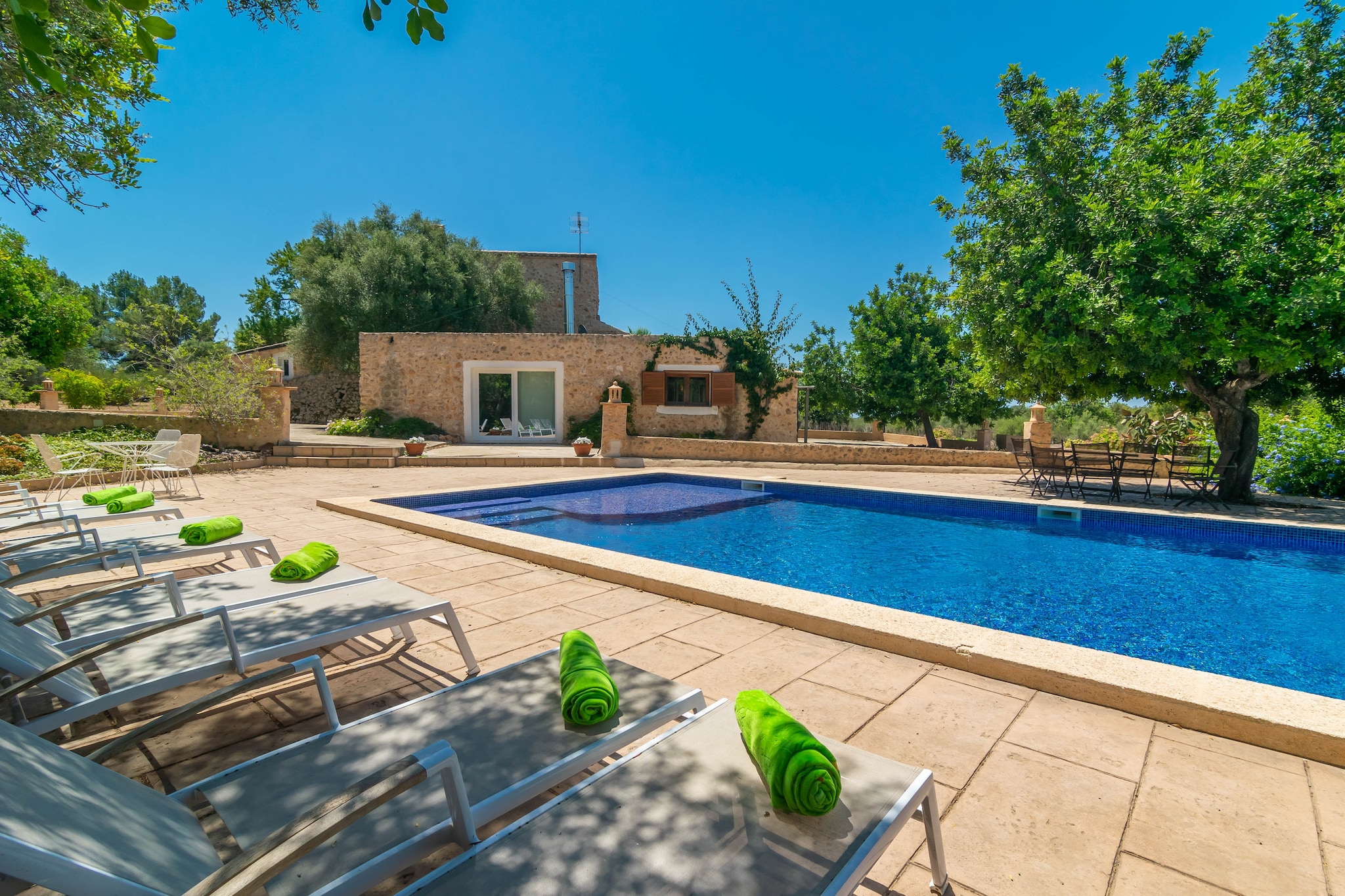 When you return from the beach, there is nothing like a relaxing bath in the water salt pool that measures 10 x 5 meters and has a depth of 0.3 to 1.8 meters. There are 8 sun loungers and a terrace area where you can enjoy a delicious barbecue. In this accommodation you can enjoy total privacy.
The house has two floors decorated with exquisite taste. The great living room offers Smart TV and AC. The kitchen-dining room is fully equipped and has a ceramic hob. There is also a washing machine, iron and ironing board. In this house there are 3 bedrooms. Two of them are on the ground floor, one with a double bed and an en suite bathroom with a shower, and the other with twin beds. There is another bathroom with shower on this floor. On the first floor there is another bedroom with a double bed and an en-suite bathroom with a shower. All bedrooms have AC. If you are travelling with your baby, we can provide a cot and highchair.
The villa is located on the outskirts of Llucmajor, in a residential area. To access the farm you will have to travel the last 200 m through an unpaved road. The town offers all the necessary services for an independent stay. The closest beach is El Arenal with a great summer atmosphere, but not far away you will also find dream beaches in the beautiful south of the island such as Es Trenc and Cala Pi. Note: This accommodation is intended for families and guests over 27 years old who are looking for a peaceful stay. Bookings for parties or celebrations are not accepted. A copy of the identification document of all guests will be required to confirm the reservation. Consult the advertiser for possible charges. Pets are not allowed. The holding of events is forbidden. There is exterior parking for 4 cars.
Distances
Beach: 11.4 km - El Arenal
Airport: 16.4 km - Son Sant Joan
Golf course: 18.4 km - Golf Son Gual
Town: 6.5 km - Llucmajor
Train station: 22.4 km - Palma
Bus stop: 7.4 km - Llucmajor
Ferry: 25.8 km - Palma
Hospital: 24.8 km - Hospital Universitari Son Espases
Guests are kindly required to dispose of all rubbish and ensure the property is properly tidied before departure. Should this not be the case, a charge of €90 will be deducted from the security deposit. Tourist license: ETV/11208Single Rental Registry: ESFCTU0000070180002652610000000000000000000ETV/112086There's a mandatory tourist tax in Balearic Islands, called Ecotasa. All guests, except people under 16 years, have to pay this tax. The amount varies between 0.55€/night and guest during the low season and 2.2€/night and guest during the high season .The tax is reduced by half from the 9th day for your stay. Homerti - Central de Reservas CR/33 Air Conditioning (January - December): 20 EUR/Night (optional) <br> <br />