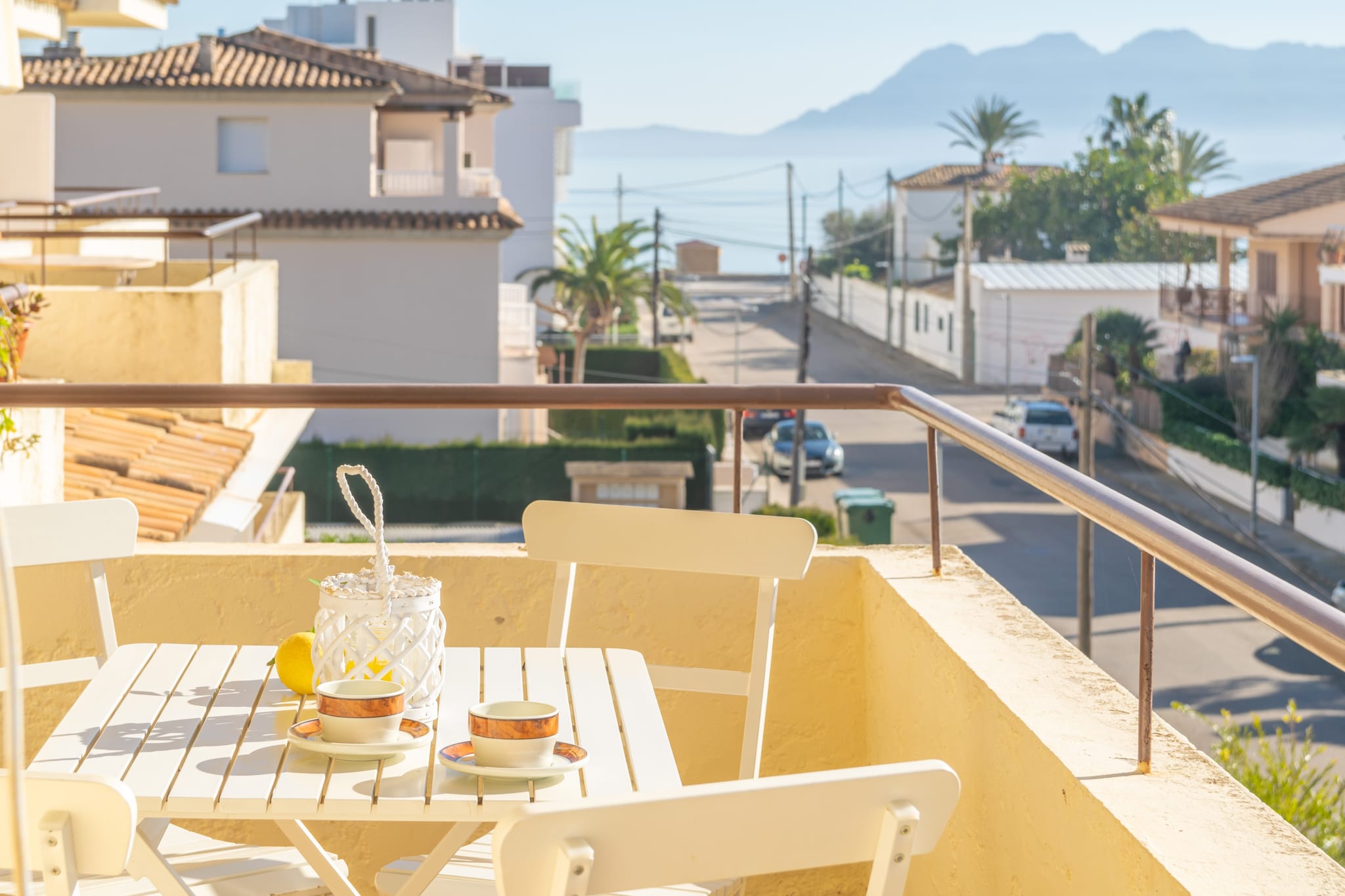 The terrace of the apartment is the perfect place to relax after a day of sun and beach. With views of the sea at the end of the street, nothing better than a drink at sunset in the chairs and table on the terrace.
The apartment is on the second floor without elevator and offers a modern and cozy style. The dining room is equipped with TV-sat and air conditioning. The separate kitchen has a ceramic hob and all the basic equipment to cook during your vacation. There is also a washing machine, iron and ironing board. Our guests will sleep in two bedrooms, one with a double bed and the other with twin beds. You also have a modern bathroom with shower. Finally, a cot, a high chair and a fan complete the accommodation.
Port de Pollença is one of the best holiday destinations in Mallorca, with a very familiar and calm atmosphere. The street from the apartment leads directly to the sandy beach. From here, you can start a relaxing walk along the beach until you reach the center of the port where you will be amazed by the picturesque promenade, full of shops and restaurants. You cannot forget to visit the beautiful towns of Pollença and Alcúdia, the viewpoint of Formentor or Cala San Vicente. Consult the advertiser for possible charges. Pets are not allowed. The holding of events is forbidden.
Distances
Beach: 0.170 km - Port de Pollença
Airport: 66.3 km - Palma de Mallorca
Golf course: 10.5 km - Pollença Golf Club
Town: 1.8 km - Port de Pollença
Train station: 20.7 km - Sa Pobla
Bus stop: 0.450 km - Port de Pollença
Ferry: 10.2 km - Port d'Alcúdia
Hospital: 30.2 km - Hospital Comarcal d'Inca
Tourist license: ETVPL/13613Single Rental Registry: ESFCTU00000703000030689800000000000000000ETVPL/136130The Ecotasa (tourist tax) must be paid cash on site when checking in. The amount varies between 0.55€/night and guest during the low season and 2.2€/night and guest during the high season. The tax is reduced by half from the 9th day of your stay. All guests have to pay the Ecotasa, except people under 16 years. Homerti - Central de Reservas CR/33