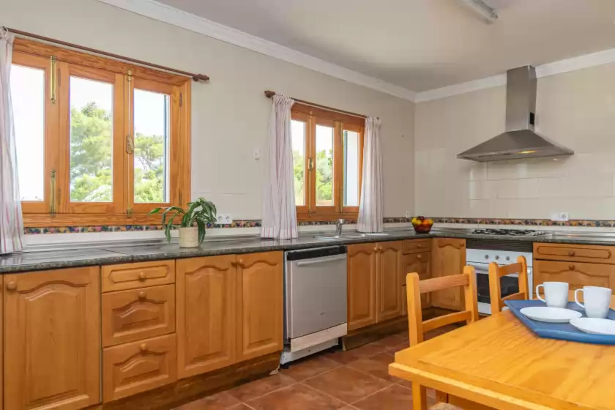 This beautiful chalet invites you to spend an unforgettable holiday and feel at home. The property is surrounded by trees and you can enjoy the mountain views while you refresh yourself with a cold shower in the outdoor shower or enjoy a drink on the porch with your companions after a full day of sightseeing around the island. Please note that being in an urbanization you have neighbours nearby but without giving up your privacy and tranquillity. 

The interior of the house is spread over two floors. On the ground floor you will find a living-dining room with smart TV, fireplace, a dining table and two comfortable sofas where you can relax while listening to music or watching a movie with the CD and DVD player. The independent gas kitchen is equipped with all the necessary utensils for you to cook in comfort. There is also a washing machine, iron and ironing board. A bedroom with a double bed and a bathroom with a bath complete this floor. Upstairs you will find four more bedrooms and a bathroom with a bathtub. There are two bedrooms with double beds, one with two single beds and one with a bunk bed for two people. From one of the three bedrooms on this floor you have access to a balcony where you can sunbathe in one of the hammocks or enjoy the sea view while having a drink. If you are travelling with your baby, we can provide you with a cot and a high chair. 

The property is located in the urbanisation of Son Coll, near Banyalbufar. Banyalbufar is a hidden treasure of the island with idyllic landscapes and a relaxed atmosphere. Located in the Serra de Tramuntana mountain range, it is nestled on a hillside sloping down to the Mediterranean Sea, giving it breathtaking panoramic views and a unique experience. Nature lovers can enjoy walks and trails that wind through the pine and olive forests, offering breathtaking views of the sea and mountains. If you prefer to enjoy the sea you will find small coves and beaches where you can relax and enjoy the sea breeze. In addition, the local restaurants offer delicious Mediterranean gastronomy with fresh fish and seafood dishes, as well as local wines produced in the local vineyards. 

Please note that the use of barbecue is strictly forbidden. Consult the advertiser for possible charges. Pets are not allowed. The holding of events is forbidden. There are parking space for 3 cars in the garage. 
Distances
Beach: 0.250 km - Platja Port des Canonge
Airport: 31.9 km - Aeropuerto Palma de Mallorca
Golf course: 17.1 km - Golf de Son Termes
Town: 11 km - Banyalbufar
Train station: 20.2 km - Universitat de les Illes Balears
Bus stop: 11.2 km - Banyalbufar
Ferry: 27.5 km - Palma
Hospital: 19.2 km - Hospital Universitario Son Espases
Tourist license: ETV/10841Single Rental Registry: ESFCTU0000070280000724310000000000000000000ETV/108412There's a mandatory tourist tax in Balearic Islands, called Ecotasa. All guests, except people under 16 years, have to pay this tax. The amount varies between 0.55â‚¬/night and guest during the low season and 2.2â‚¬/night and guest during  the high season .The tax is reduced by half from the 9th day for your stay.