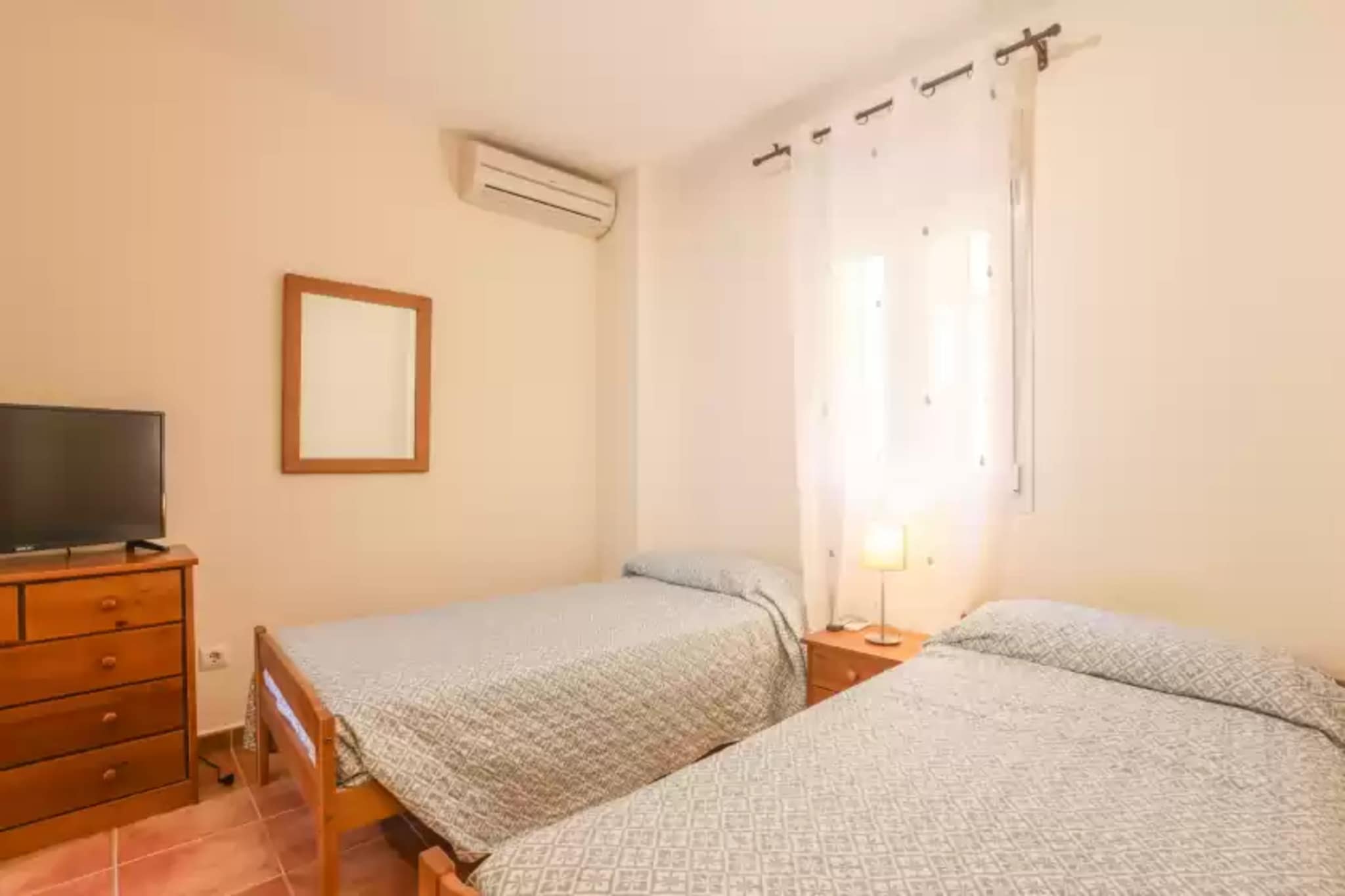 Living room, dining room, Kitchen(cooker, coffee machine, oven), bedroom(2x single bed), bedroom(double bed), bathroom, bathroom, microwave, dishwasher, fridge-freezer, bath tub, shower, washbasin, washbasin, toilet, toilet, air conditioning, air conditioning, parking, swimming pool, children\'s bed, high chair