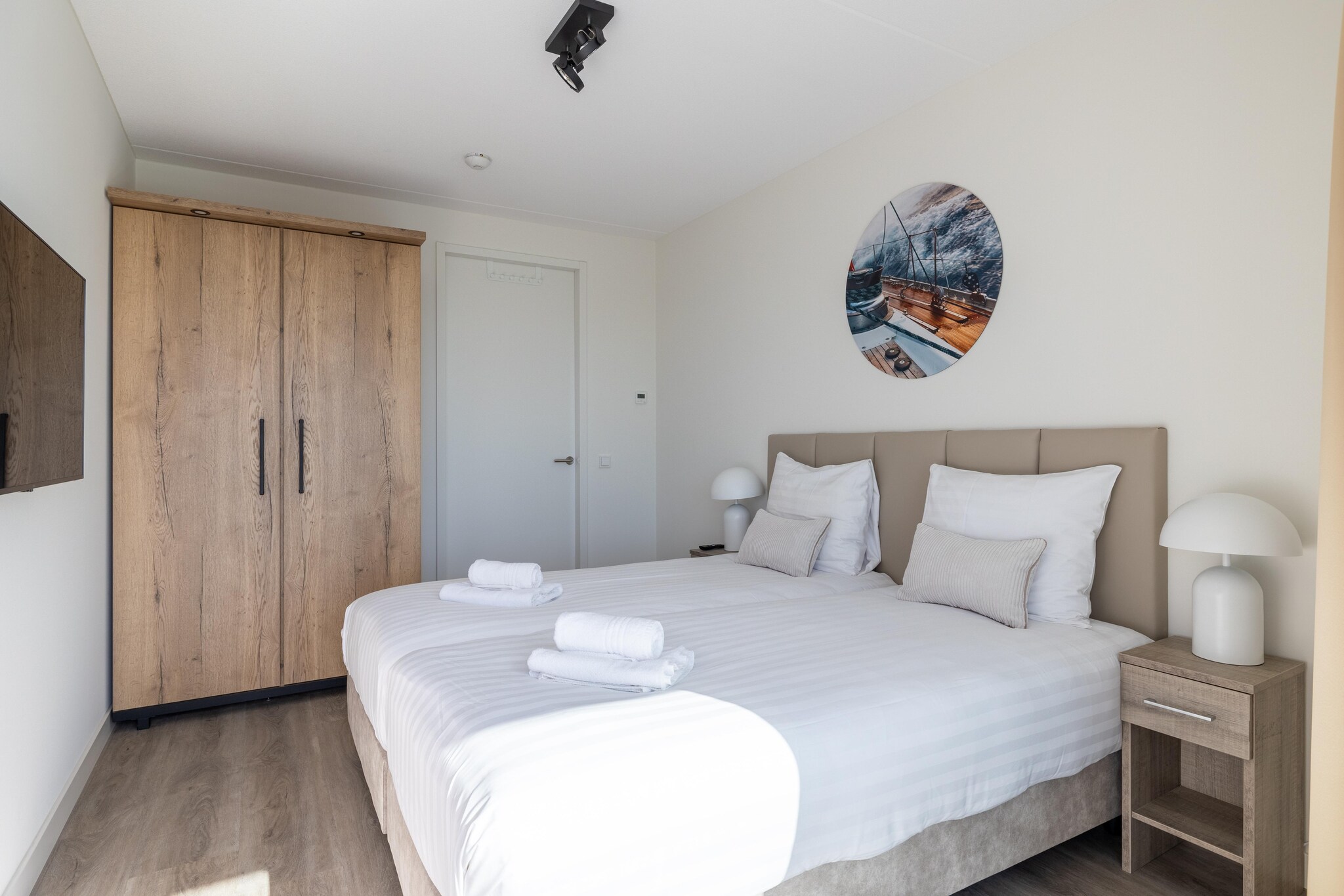 Ground floor: (Living room(TV, seating area, streamingservice), Kitchen(dining table, stove, electric kettle, toaster, coffee machine, espresso machine, combination microwave, dishwasher, fridge-freezer, balcony or terrace, dishes and cutlery, Cooking basics), bedroom(double bed, TV), bedroom(double bed), bathroom(shower, washbasin, toilet), toilet)\n\ncot, washing machine, garden(fenced), bicycle storage, garden furniture, parking, lift, high chair, Essentials, heating, Water view