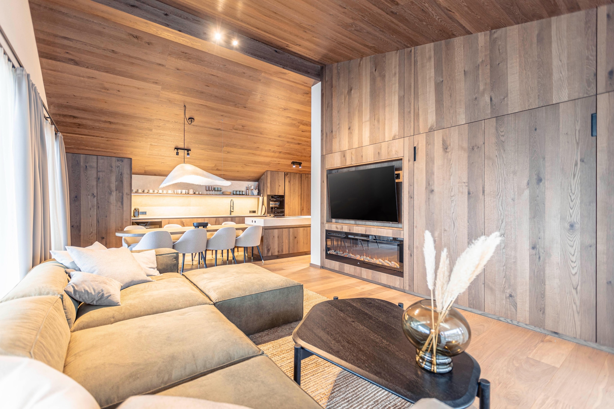 Living room(double sofa bed, TV(flatscreen, satellite), balcony or terrace, gas fireplace), open kitchen(dining table, electric kettle, toaster, cooker(4 ring stoves, ceramic), coffee machine(cups), oven, microwave, dishwasher, fridge-freezer), bedroom(double bed, TV(flatscreen, satellite), shower, washbasin, balcony or terrace), bedroom(double bed, TV(flatscreen, satellite), shower, washbasin, toilet, balcony or terrace), bedroom(double bed(140 x 200 cm), TV(flatscreen, satellite)), bathroom(shower, washbasin), toilet, Landing(lift), ski storage(ski boot heaters), carport, Internet access, sauna(private), terrace, bicycle storage, hairdryer