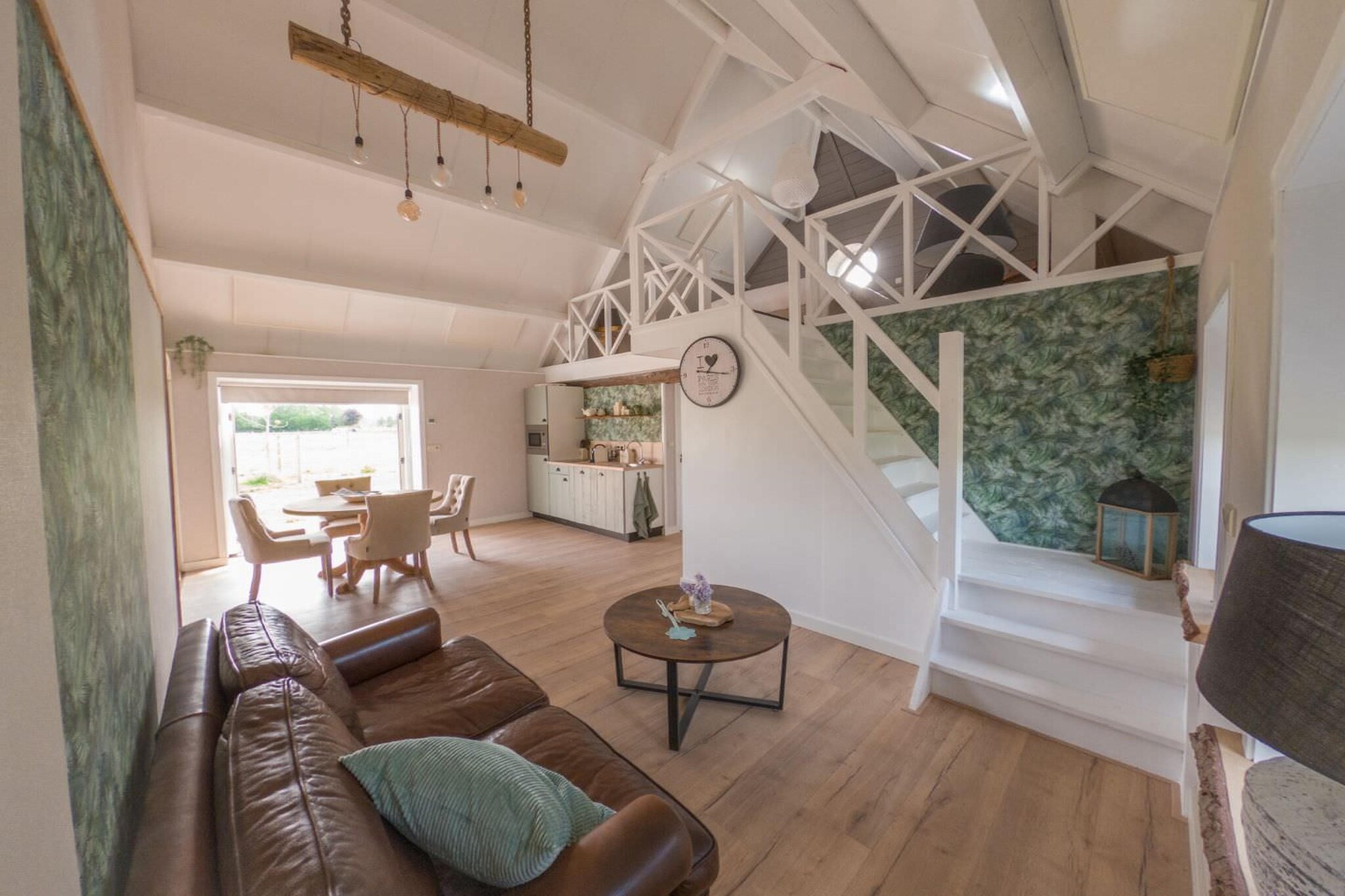 This beautifully transformed stable in Sint-Oedenrode offers a unique blend of rustic charm and modern comfort. Designed as two separate apartments that can easily be joined via a sliding door, it provides versatile accommodation tailored for groups seeking privacy and togetherness. The spacious living areas are perfect for relaxing, while fully equipped kitchens invite you to prepare your favourite meals. Outside, the enchanting gardens with adjustable wooden fencing create a peaceful retreat where everyone can unwind and enjoy the fresh air surrounded by nature.

Situated in the heart of North Brabant, this holiday home serves as an excellent base for exploring the picturesque countryside and nearby attractions. Just a short drive away is Kasteel Henkenshage, a stunning historic castle offering cultural tours and beautiful grounds to wander. Nature lovers will appreciate the nearby hiking and cycling routes that wind through charming landscapes, while Best Zoo, only 7 km away, provides a fun day out for all ages. The vibrant city of Eindhoven is also within reach, offering museums, shopping, and lively events to complement your rural escape.

Nearby villages and towns offer a range of dining experiences that showcase the best of North Brabantâ€™s culinary scene. Within a few minutes, youâ€™ll find cozy cafÃ©s and traditional Dutch eateries serving hearty meals and local specialities. The nearby Coop Liempde provides fresh local produce, perfect for preparing your dishes at the holiday home. Whether you prefer a relaxed meal in a quaint setting or exploring vibrant culinary spots in Eindhoven, this location ensures delightful flavours are always close at hand.