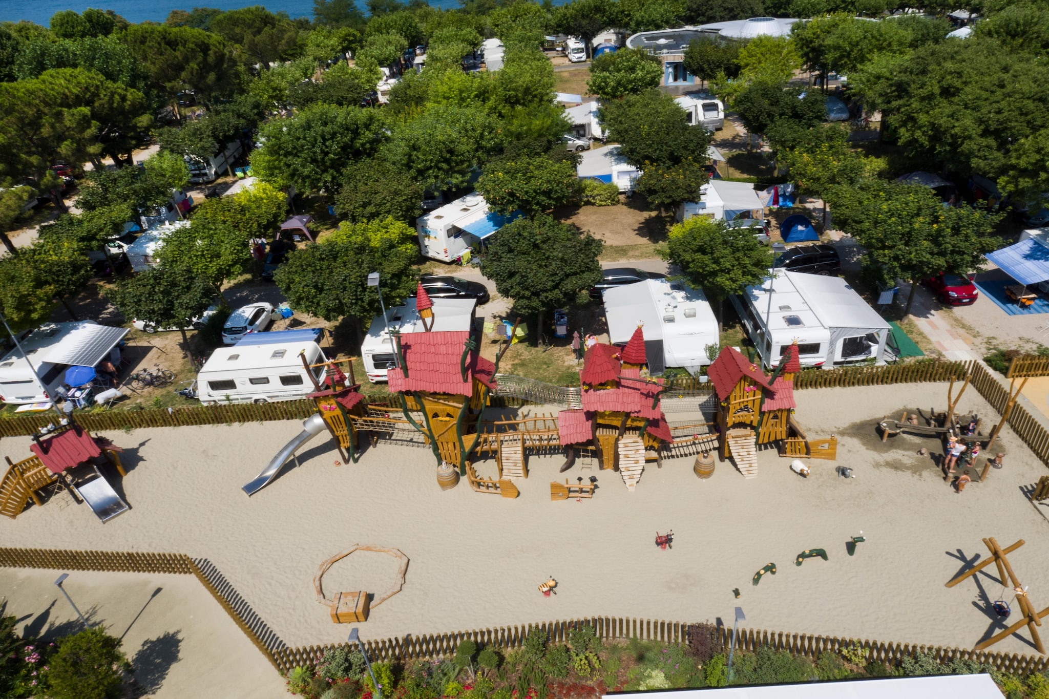 Ground floor: (Living room(single sofa bed, TV(satellite)), Kitchenette(hob(2 ring stoves, electric), coffee machine, microwave, fridge), bedroom(Queen Bed), bedroom(double bed, double king size bed), bathroom(shower, toilet), heating(through air conditioning), air conditioning, terrace, garden furniture)\n\nReception, Parking, Waterslide, Shop, Mini market, Minigolf, Bike rental, Sporting field(s), Restaurant, Bar, Kids club, tumble dryer(shared with other guests, paid), washing machine(shared with other guests, paid), garden(shared with other guests), sun loungers, parasol, swimming pool(shared with other guests, outside, including separate childrenâ€™s swimming pool (depth 50cm), opened from Jul upto and including Aug), swimming pool(shared with other guests, outside, opened from Jul upto and including Aug), swimming pool(shared with other guests, outside, opened from Jul upto and including Aug), swimming pool(shared with other guests, outside, opened from Jul upto and including Aug), swimming pool(shared with other guests, outside, opened from Apr upto and including Sep), swimming pool(shared with other guests, outside, opened from Apr upto and including Sep), tennis court(shared with other guests), table tennis table(shared with other guests), padel court, baby crib(paid)