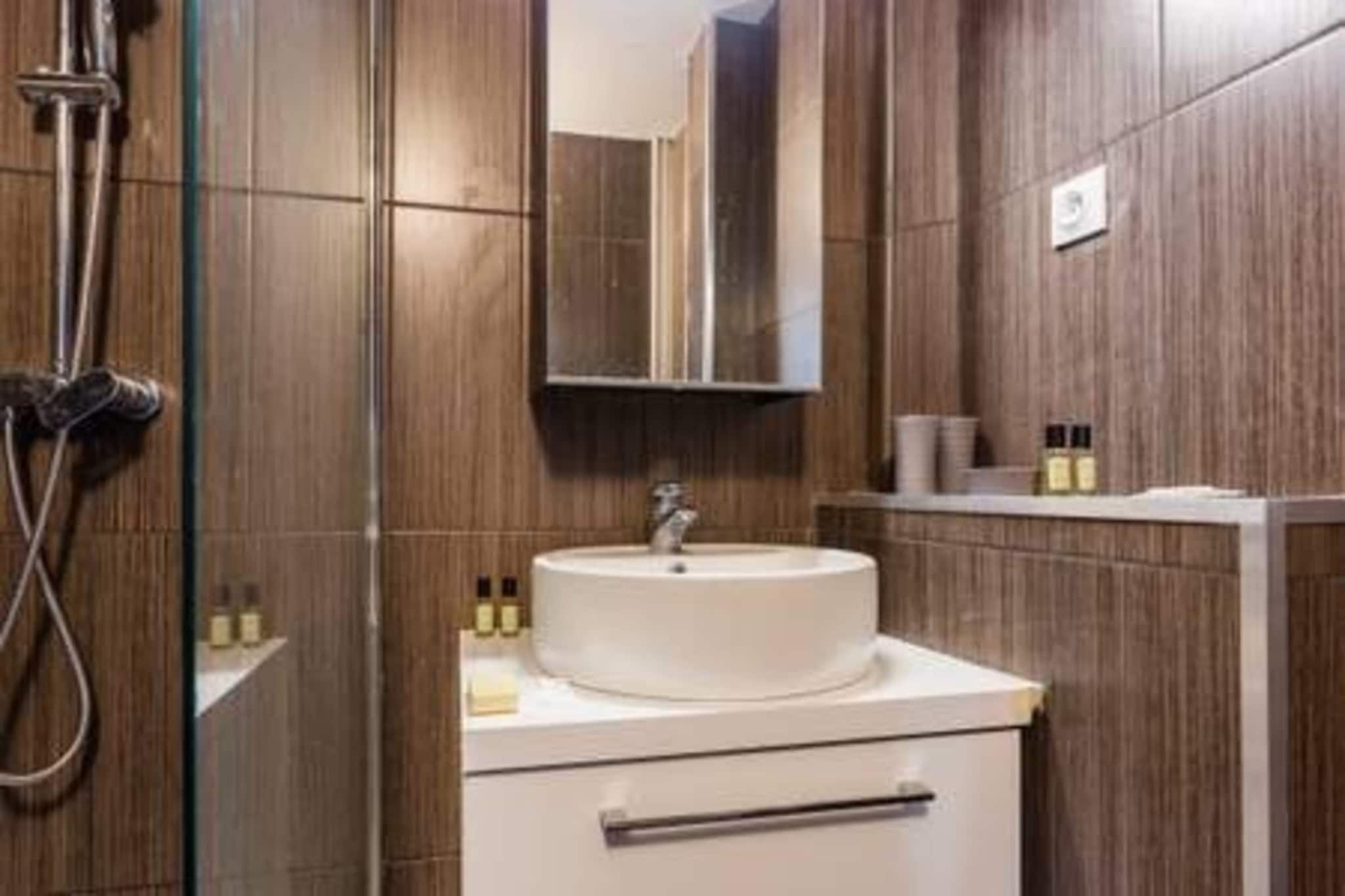 Ground floor: (Kitchen(dining table, stove, toaster, coffee machine, microwave, dishwasher, fridge, dishes and cutlery, Cooking basics), Living/bed room(double bed, double sofa bed, TV), bathroom(shower, toilet, Towels/Sheets (Incl.), shampoo, Essentials))\n\nBed Linen, Desk, Elevator, Hot Water, Internet Access DSL, Wardrobe, First Aid, Play area, balcony or terrace, heating, iron, hairdryer, Carbon monoxide detector, Cleaning Disinfection, Downtown, Enhanced cleaning practices, High touch surfaces disinfected, Long term stays allowed, Roll-in shower with shower bench or chair, Town