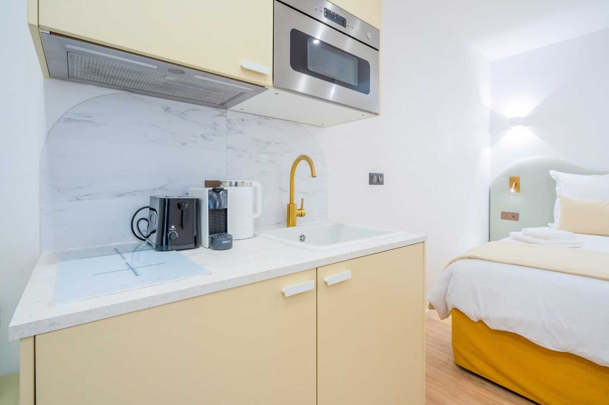 The flat is ideally located in the hyper centre of St Tropez, 3 minutes walk from the port.
null
The 19m2 studio is located on the ground floor and consists of :
Living Space:
The living space is the central area of the studio, serving multiple functions. With a comfortable double bed (160x190), it provides a cozy sleeping area. During waking hours, this space can be used for relaxation, work, or other activities. The design of the living space aims to maximize functionality and comfort within the limited square footage.
Fully Equipped Kitchen:
The kitchen is equipped with essential appliances to facilitate convenient meal preparation. The inclusion of a fridge allows for the storage of perishable items, while the oven and induction cooker provide options for cooking various dishes. Small appliances such as a toaster, coffee machine, and kettle add to the kitchen's functionality, catering to different culinary needs. The presence of a microwave offers quick and efficient cooking solutions.
Bathroom:
The bathroom is designed to optimize space while providing essential facilities. The shower and toilet (WC) are key components, ensuring that residents have access to personal hygiene amenities within the confines of the studio. The design likely focuses on efficient use of space while maintaining a modern and comfortable bathroom environment.
Additional Amenities:
-Air Conditioning:
The inclusion of air conditioning contributes to a pleasant living environment, allowing residents to control the temperature according to their preferences. This feature is particularly valuable for ensuring comfort during varying weather conditions.
-TV:
The presence of a television enhances the entertainment options available to residents. Whether for relaxation or staying updated with the latest news, the TV contributes to the overall living experience.
-Sheets and Towels Provided:
The studio goes the extra mile by providing sheets and towels. This thoughtful touch eliminates the need for residents to bring their own bedding and linens, simplifying the moving-in process.
In summary, this 19m2 studio on the ground floor is designed with a focus on functionality, comfort, and convenience. The thoughtful inclusion of amenities such as a fully equipped kitchen, air conditioning, and provided sheets and towels ensures that residents have everything they need for a comfortable living experience within this compact space.