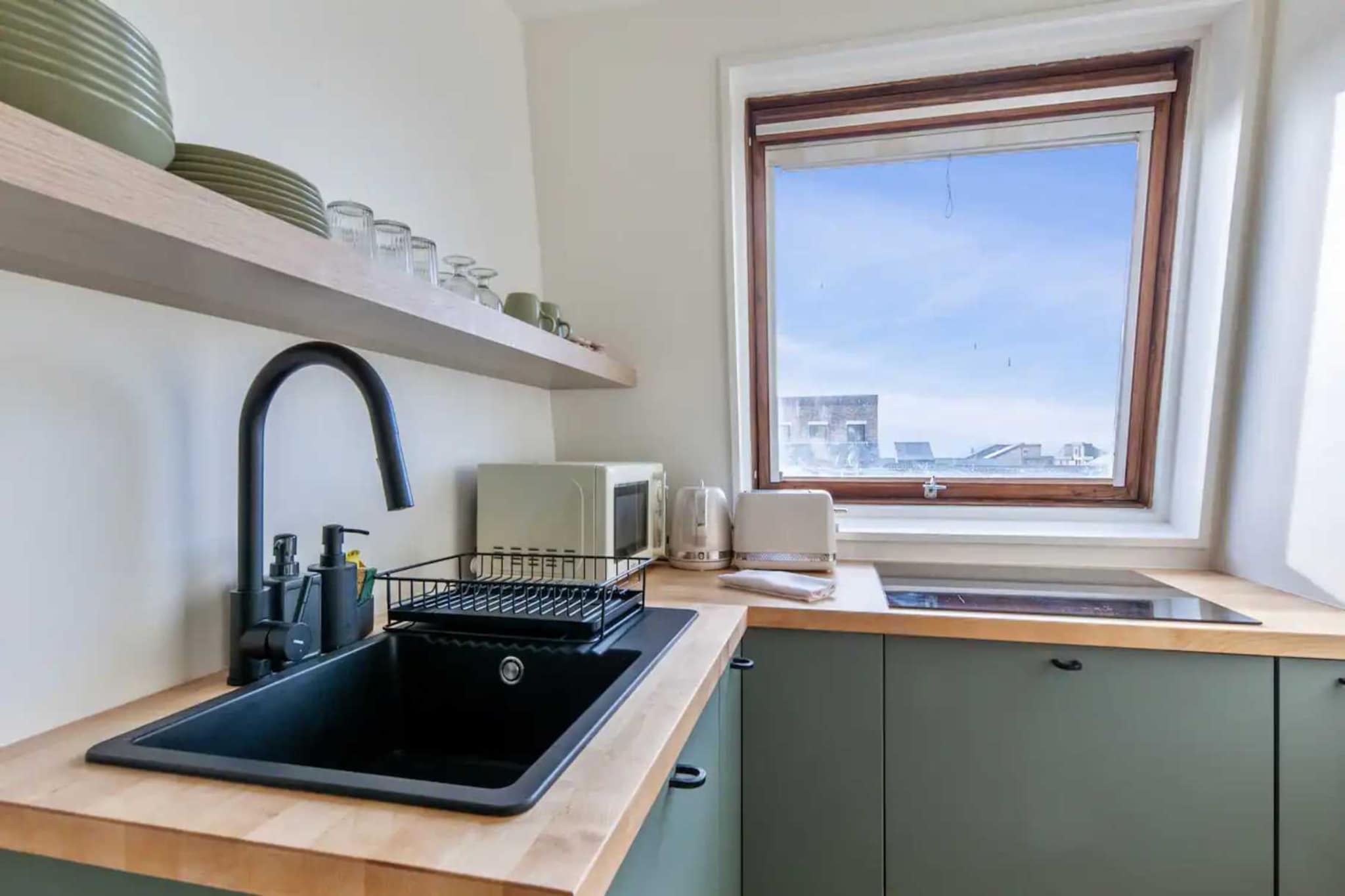 Checkmyguest offers you this modern and beautifully decorated studio, located in the port of Deauville, is ideal for up to four people. With a magnificent view of the port and the sea, this accommodation offers an exceptional setting for your stay.

The apartment's location means you can get around quickly and easily: 

BY PLANE: Deauville Saint-Gatien airport (8 km / 15 min)
BY TRAIN: Deauville/Trouville train station (15 min walk)

BY CAR: A32 freeway (7.5 km / 10 min)
BY CAR: A13 freeway (10 km / 12 min)

BY CAR: Paris (200 km / 2h15)
BY CAR: Caen (45 kms /40mn)
BY CAR: Le Havre (45 kms / 50mn)

Here are three interesting things to do near Deauville:

Visit Trouville-sur-Mer: Located just a few kilometers from Deauville, Trouville-sur-Mer is a charming neighboring seaside resort. You can stroll along the long sandy beach, explore the picturesque fishing port, and enjoy fresh seafood at one of the many waterfront restaurants. 

Deauville Casino: Deauville's Casino BarriÃ¨re is one of the region's most prestigious establishments. Even if you're not a gambling enthusiast, you can visit the casino for its remarkable architecture and elegant ambience. 

Horseback riding on the beach: Enjoy a unique experience in Deauville by booking a horseback ride on the beach. Renowned for its horse racing and top-quality equestrian facilities, the town offers an exceptional opportunity to discover the beauty of the Normandy coastline.

These activities offer a glimpse of the wonders of Deauville and the surrounding area. Whatever your preference, whether for relaxation, cultural discovery or outdoor adventure, Deauville and its surroundings have something to offer every visitor.