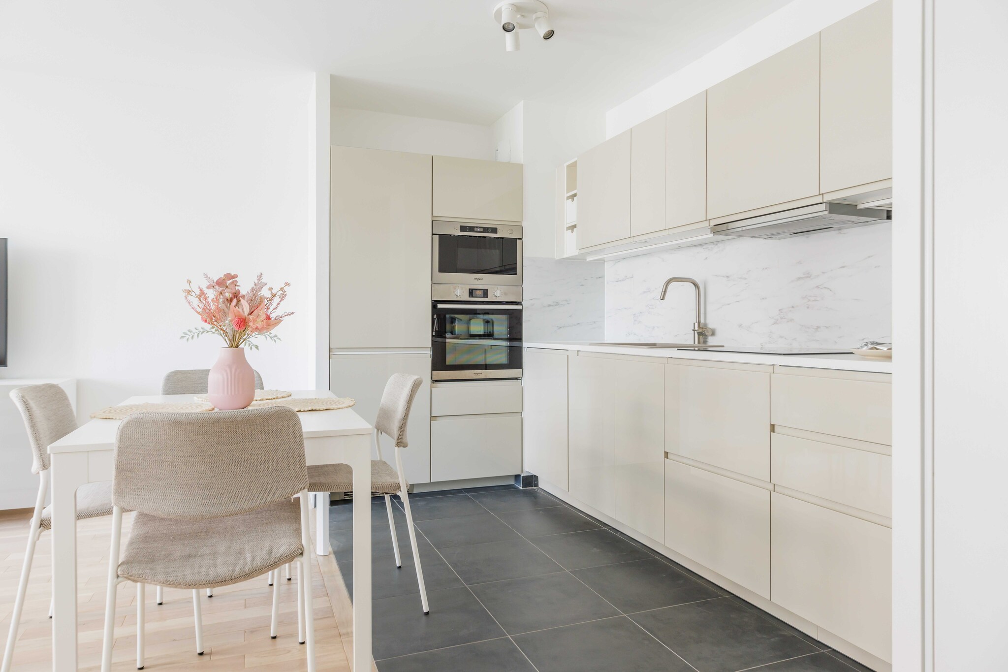 On the 5th floor: (Living room(TV, dining table, seating area), open kitchen(stove, hob, electric kettle, toaster, oven, combination microwave, dishwasher, fridge, dishes and cutlery, Cooking basics, Wine glasses), bedroom(double bed), bedroom(double bed), bathroom(bath tub, washing machine, hairdryer, shampoo, body soap, hot water, Essentials), toilet(toilet))\n\nBed Linen, Elevator, Internet Access DSL, Wardrobe, First Aid, balcony or terrace, heating, iron, hairdryer, Towels/Sheets (Incl.), Carbon monoxide detector, Downtown, Enhanced cleaning practices, Long term stays allowed, Room-darkening shades, Town