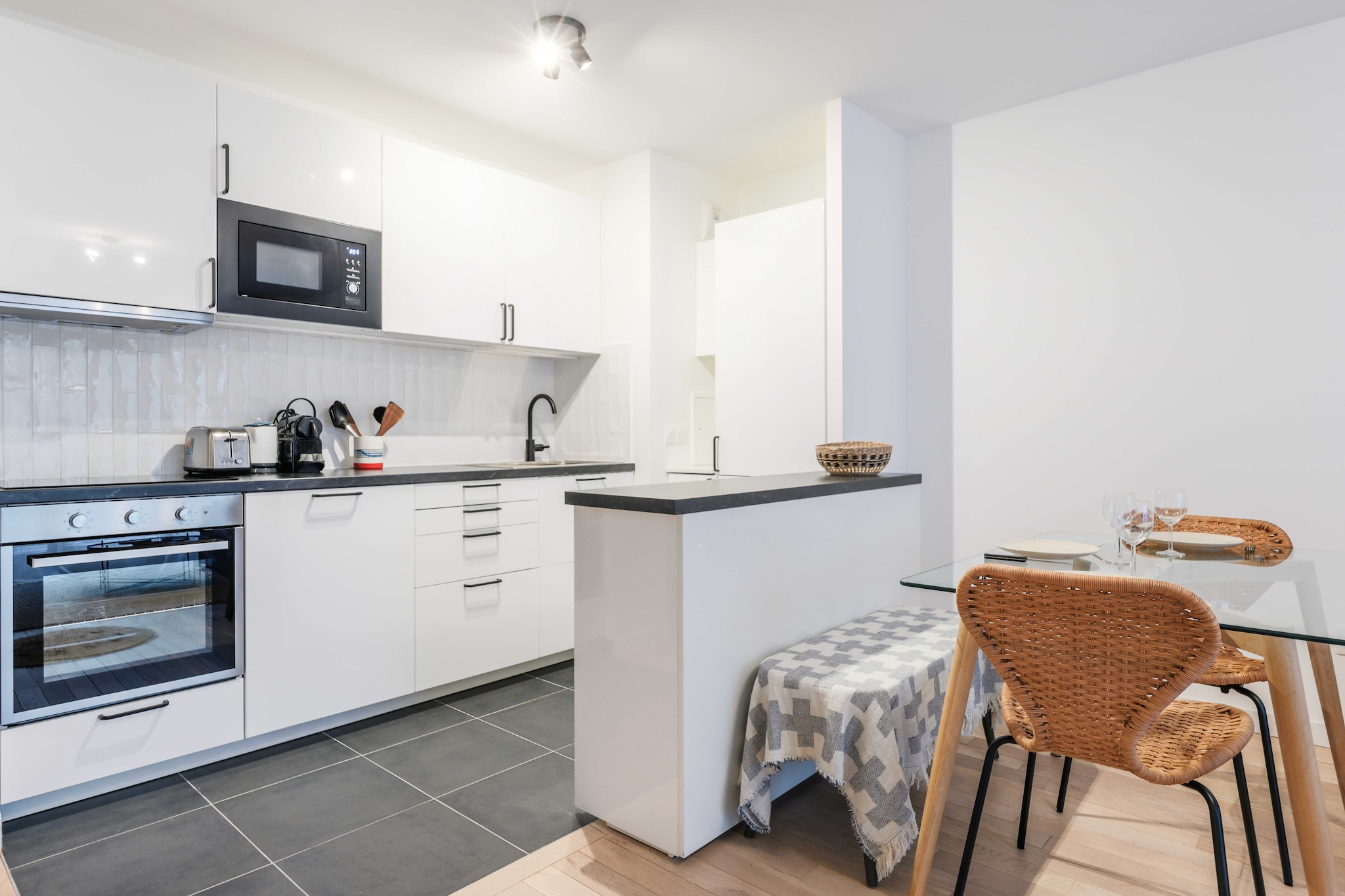 On the 5th floor: (Living room(Internet Access DSL, single bed, TV, dining table), Kitchen(stove, electric kettle, toaster, coffee machine, oven, microwave, dishwasher, fridge, dishes and cutlery, Cooking basics), bedroom(Bed Linen, double bed), bedroom(Wardrobe, double bed), bathroom(bath tub, washbasin, washing machine, hairdryer, Towels/Sheets (Incl.), shampoo), toilet(toilet))\n\nElevator, Hot Water, First Aid, Play area, balcony or terrace, heating, iron, Essentials, Cleaning Disinfection, Downtown, Enhanced cleaning practices, High touch surfaces disinfected, Long term stays allowed, Room-darkening shades, Town