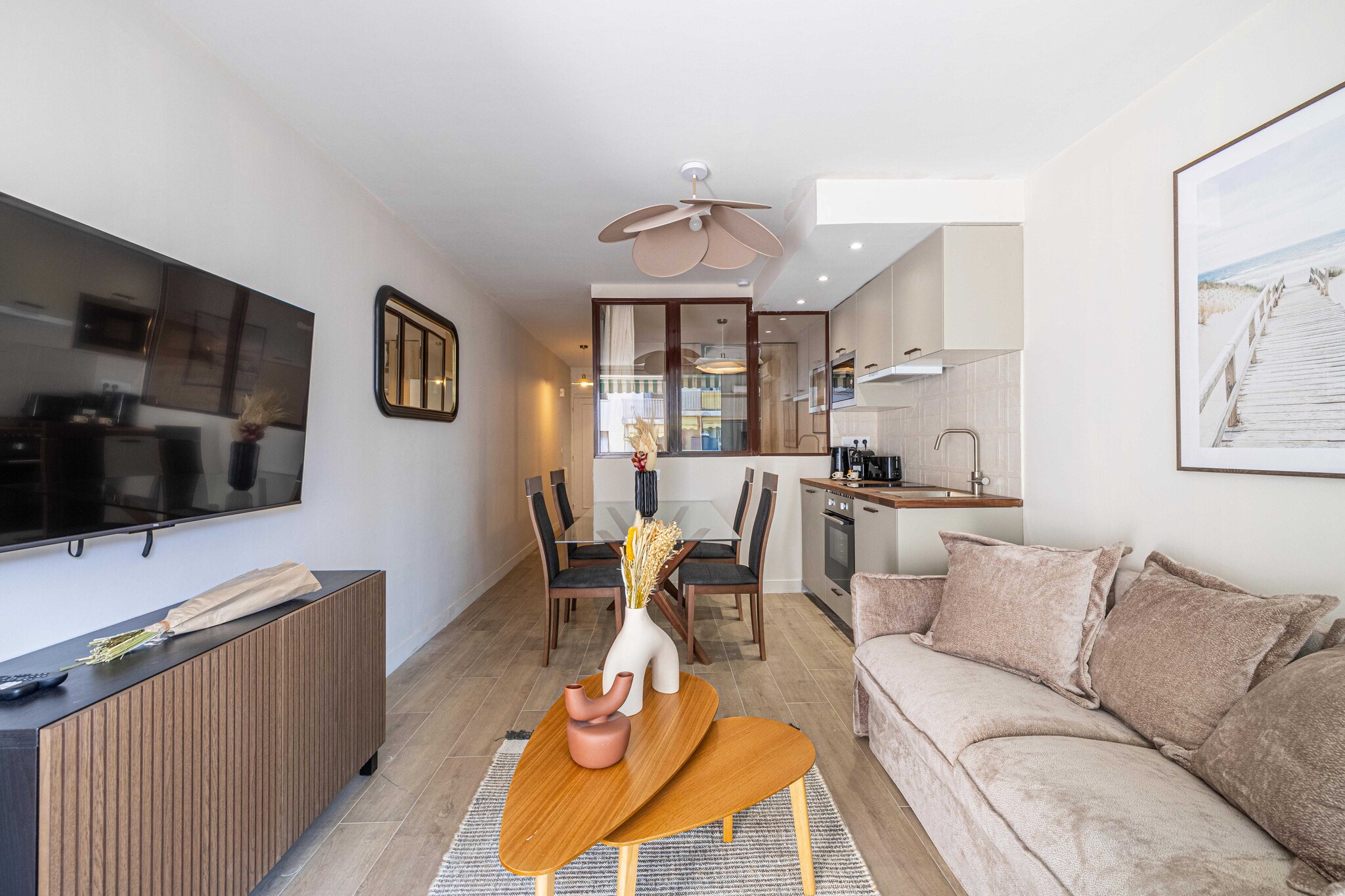 On the 3rd floor: (Living room(double sofa bed, TV, dining table), Kitchen(stove, hob, electric kettle, toaster, coffee machine, oven, combination microwave, dishwasher, fridge, dishes and cutlery, Cooking basics), bedroom(double bed), bathroom(Hot Water, shower, washbasin, toilet, hairdryer, shampoo))\n\nBed Linen, Elevator, Wardrobe, First Aid, Play area, cot, washing machine, balcony or terrace, heating, air conditioning, iron, Towels/Sheets (Incl.), Essentials, Dedicated workspace, Carbon monoxide detector, Cleaning Disinfection, Downtown, Enhanced cleaning practices, High touch surfaces disinfected, Long term stays allowed, Near Ocean, Room-darkening shades, Town