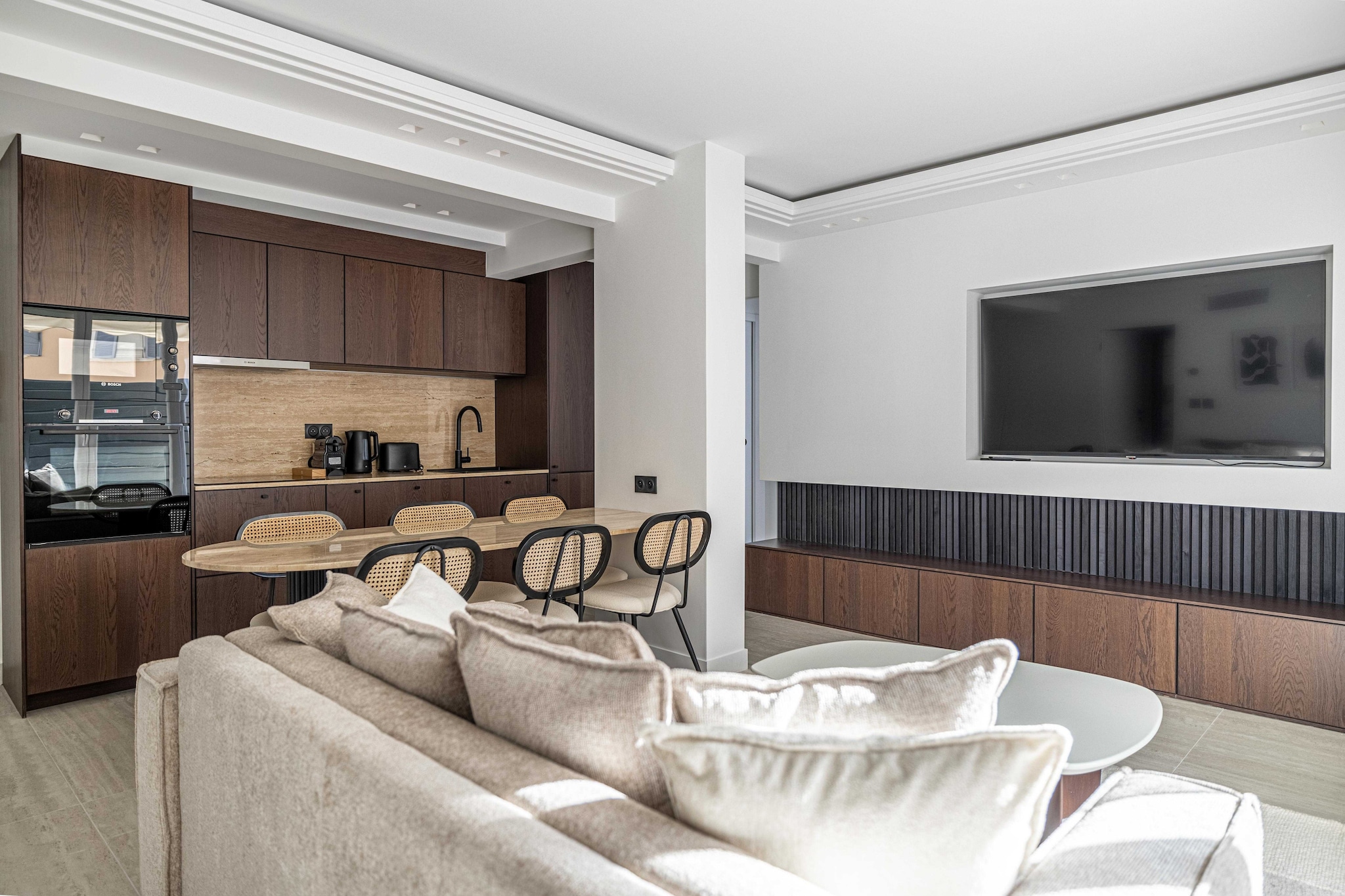 On the 1st floor: (Living room(single sofa bed, TV, dining table), Kitchen(stove, electric kettle, toaster, coffee machine, oven, microwave, dishwasher, fridge, dishes and cutlery, Cooking basics), bedroom(Wardrobe, double bed), bedroom(double bed, TV), bathroom(shower, washbasin, toilet), bathroom(shower, washbasin, toilet))\n\nBed Linen, Elevator, Hot Water, Internet Access DSL, First Aid, Play area, tumble dryer, washing machine, balcony or terrace, heating, air conditioning, iron, hairdryer, Towels/Sheets (Incl.), shampoo, Essentials, Dedicated workspace, Carbon monoxide detector, Cleaning Disinfection, Downtown, Enhanced cleaning practices, High touch surfaces disinfected, Long term stays allowed, Near Ocean, Room-darkening shades, Town, Village, Wide doorway