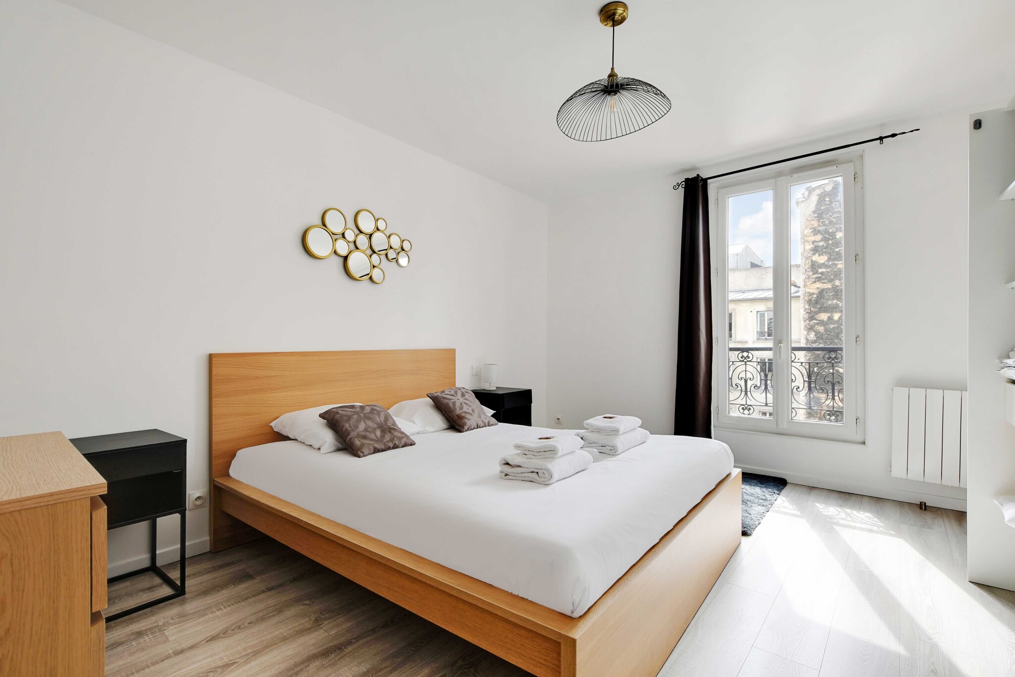 On the 3rd floor: (Kitchen(stove, electric kettle, toaster, coffee machine, oven, microwave, fridge, dishes and cutlery, Cooking basics), Living/bed room(Desk, Internet Access DSL, single sofa bed, single sofa bed, TV, dining table), bedroom(Bed Linen, Wardrobe, single sofa bed, Queen Bed), bathroom(shower, washbasin, toilet, hairdryer, Towels/Sheets (Incl.), shampoo))\n\nHot Water, First Aid, Play area, washing machine, heating, iron, Essentials, Carbon monoxide detector, Cleaning Disinfection, Downtown, Enhanced cleaning practices, High touch surfaces disinfected, Long term stays allowed, Town