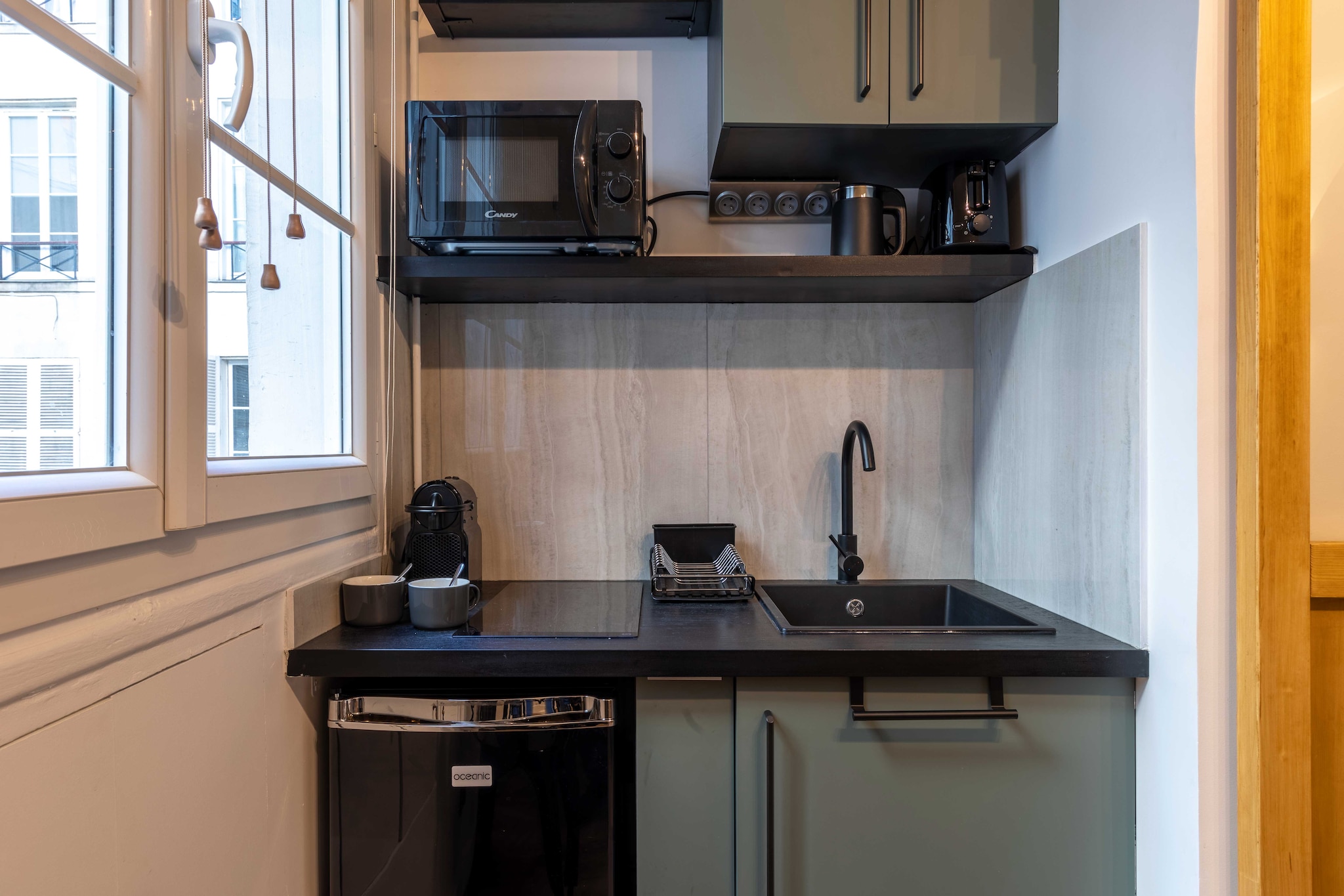 On the 1st floor: (open kitchen(dining table, stove, electric kettle, toaster, cooker, coffee machine, microwave, fridge, dishes and cutlery, Cooking basics, Wine glasses), Living/bed room(single sofa bed), bathroom(shower, toilet))\n\nDesk, Hot Water, Internet Access DSL, TV, heating, iron, hairdryer, Towels/Sheets (Incl.), shampoo, Essentials, Carbon monoxide detector, Cleaning Disinfection, Downtown, Enhanced cleaning practices, High touch surfaces disinfected, Long term stays allowed, Town