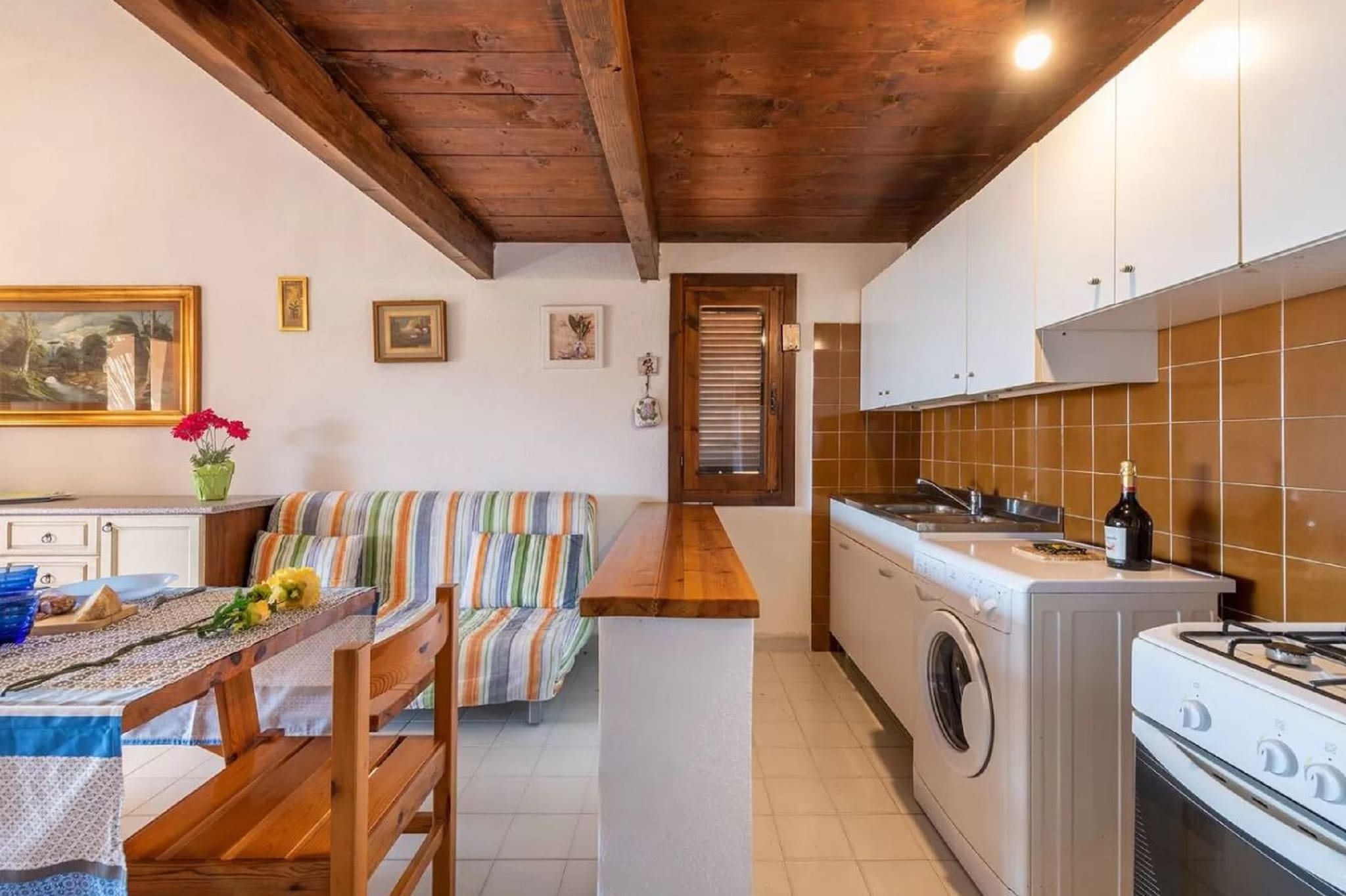 On the 2nd floor: (Living room(double sofa bed, TV, dining table), open kitchen(hob, fridge-freezer, washbasin, washing machine), bedroom(double bed), Gallery bedroom(single bed, single bed), bathroom(shower, washbasin, toilet, bidet), air conditioning, terrace, garden furniture)\n\nparking