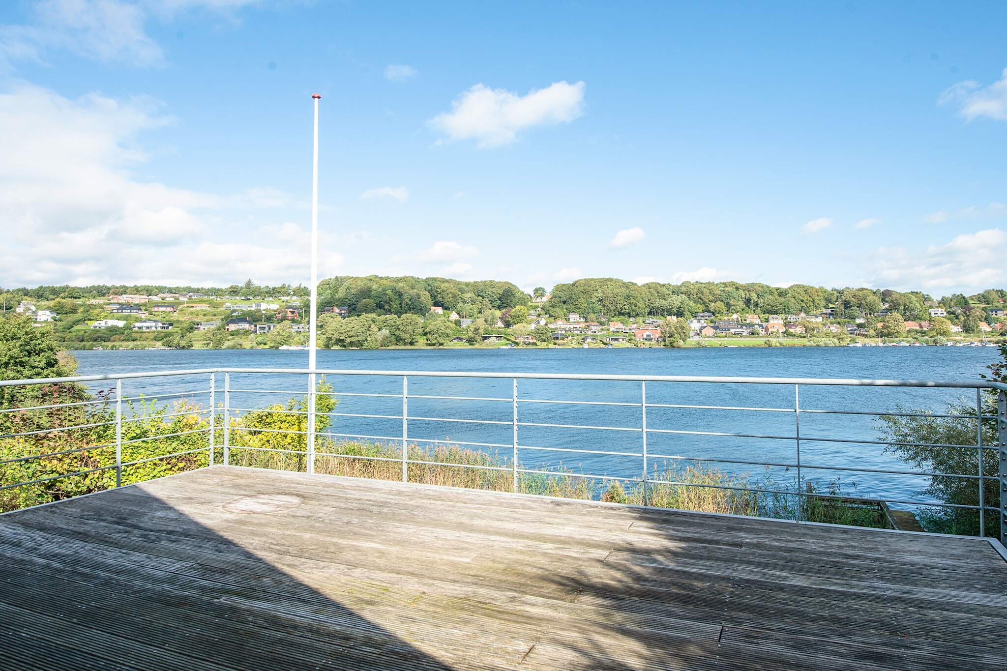 Kitchen(stove(induction), coffee machine, oven, dishwasher, fridge-freezer), Living/bed room(TV, chromecast), bedroom(double bed), bedroom(2x single bed), bedroom(double folding bed), bathroom(washbasin, shower, toilet), bathroom(washbasin, shower, toilet, washing machine), veranda, heating(electric), terrace, garden furniture