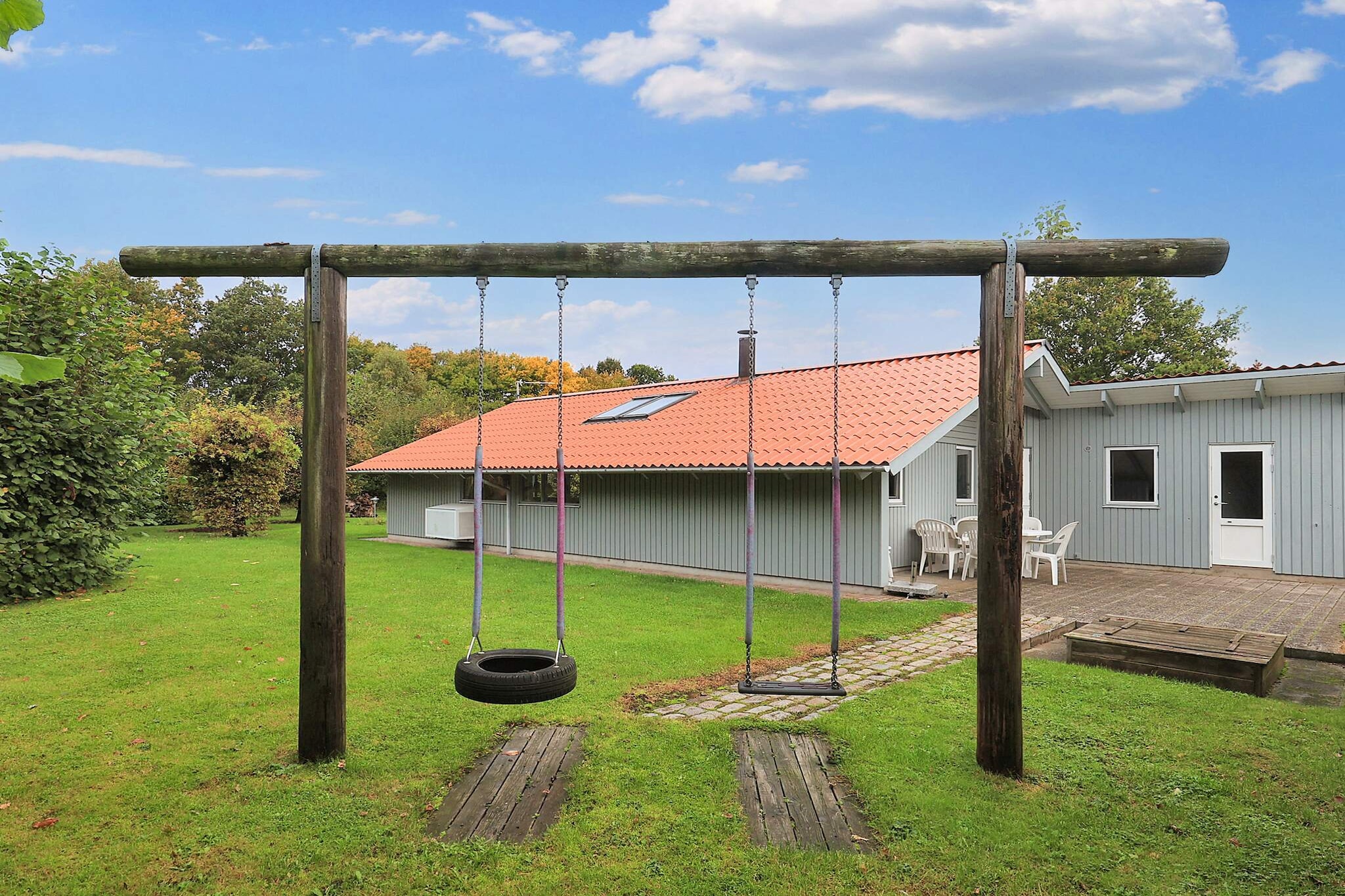 This beautiful and inviting vacation home offers a fantastic setting for a relaxing family vacation. With its beautiful terraces, including a covered one, it offers plenty of opportunities to enjoy nature regardless of the weather. Very beautiful natural property with trees and shrubs. The house is lovingly furnished and has a cozy living room with dining area, heat pump, and an atmospheric wood-burning stove. The well-equipped kitchen has a stove, oven, dishwasher, and freezer/refrigerator, so you have everything you need to prepare delicious meals. The vacation home offers four bedrooms: two with double beds and two with single beds, making it ideal for the whole family. The bathroom is a small wellness oasis with underfloor heating, a whirlpool, and a sauna, where you can pamper yourself after an eventful day. The location is unique, right next to a well-kept green area and within walking distance of a beautiful beach with a jetty. Here you can enjoy both the sun and the sea. The cozy marina in Nysted is nearby, and if you feel like a day trip, Knuthenborg Safari Park is only 12 miles away. This vacation home is the perfect starting point for an unforgettable vacation experience.A refundable deposit might be charged closer to your check-in date. The security deposit ensures a smooth stay and covers any additional services or consumption charges.This deposit covers utilities consumed during your stay and any additional services that may be taken.The final amount will be adjusted based on actual meter readings, actual usage of extra services, and any remaining balance will be refunded within 21 days after checkout.This deposit simply acts as a prepayment for charges that  you would anyways pay for, ensuring a seamless stay and check-out experience.