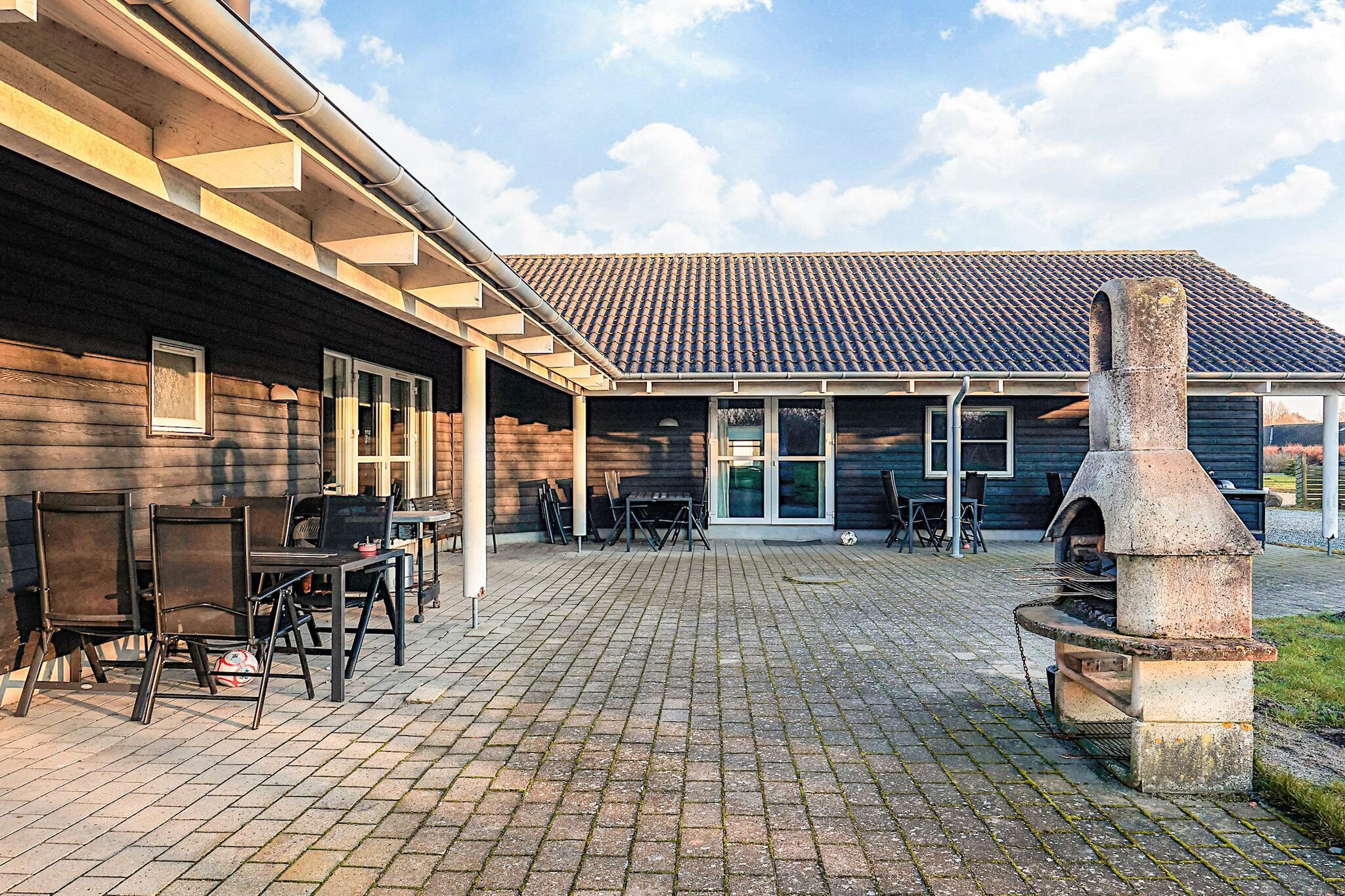 Spacious holiday home from 2009, covering 225 m², located on the outskirts of a large holiday home area in Marielyst, approximately 1000 meters from one of Denmark's best child-friendly beaches. The holiday home features a spa/sauna, an activity room, and an indoor pool. The house was partially renovated in 2019. The holiday accommodation is situated on a 2258 m² nature plot, providing plenty of space for play and games. It is 1000 m to the sea, and the nearest store is 600 m away. The property includes a terrace area of 74 m², as well as a 56 m² covered terrace, a swing, a sandpit, a play tower, and a grill. The indoor swimming pool offers opportunities for play and cozy gatherings. The pool measures up to 3.7 m in width, 5.9 m in length, and has a depth of up to 1.2 m. The water temperature ranges from 24 to 28°C. In the activity room, you will find the following equipment: billiards, table tennis, darts, table football, and a refrigerator, providing plenty of entertainment for children and the young at heart. There are a total of 6 bedrooms, with sleeping arrangements as follows: 3 bedrooms with double beds, 3 rooms with single beds, and 3 single beds in each of the house's two lofts. Additionally, there is 1 cot. The kitchen is equipped with a coffee machine, induction stove, separate oven, microwave, refrigerator, dishwasher, and a freezer with a capacity of 60-99 liters. The holiday home has three bathrooms, each with a shower, toilet, and sink. It also includes a washing machine, dryer, and 2 high chairs. The accommodation features 4 TVs, a DVD player, radio, stereo system, and CD player, with at least 4 Danish channels and at least 4 German channels available. Wireless internet is provided. Pets are not allowed. Not rented out to youth groups.A refundable deposit might be charged closer to your check-in date. The security deposit ensures a smooth stay and covers any additional services or consumption charges.This deposit covers utilities consumed during your stay and any additional services that may be taken.The final amount will be adjusted based on actual meter readings, actual usage of extra services, and any remaining balance will be refunded within 21 days after checkout.This deposit simply acts as a prepayment for charges that  you would anyways pay for, ensuring a seamless stay and check-out experience.