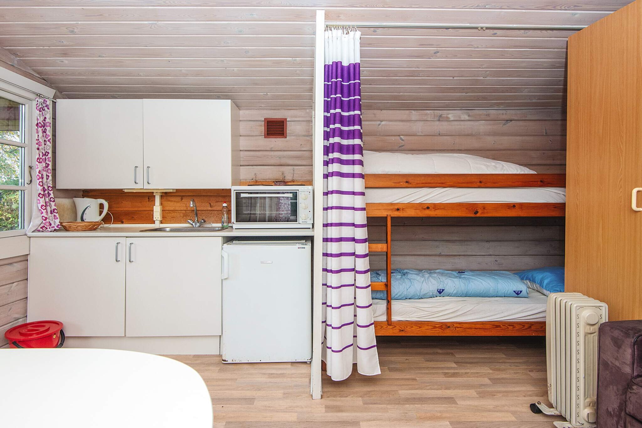 Living room(double folding bed, TV(german television channels)), Kitchen(coffee machine, oven(mini), fridge), bedroom(4x bunk bed), heating(electric), garden, garden furniture