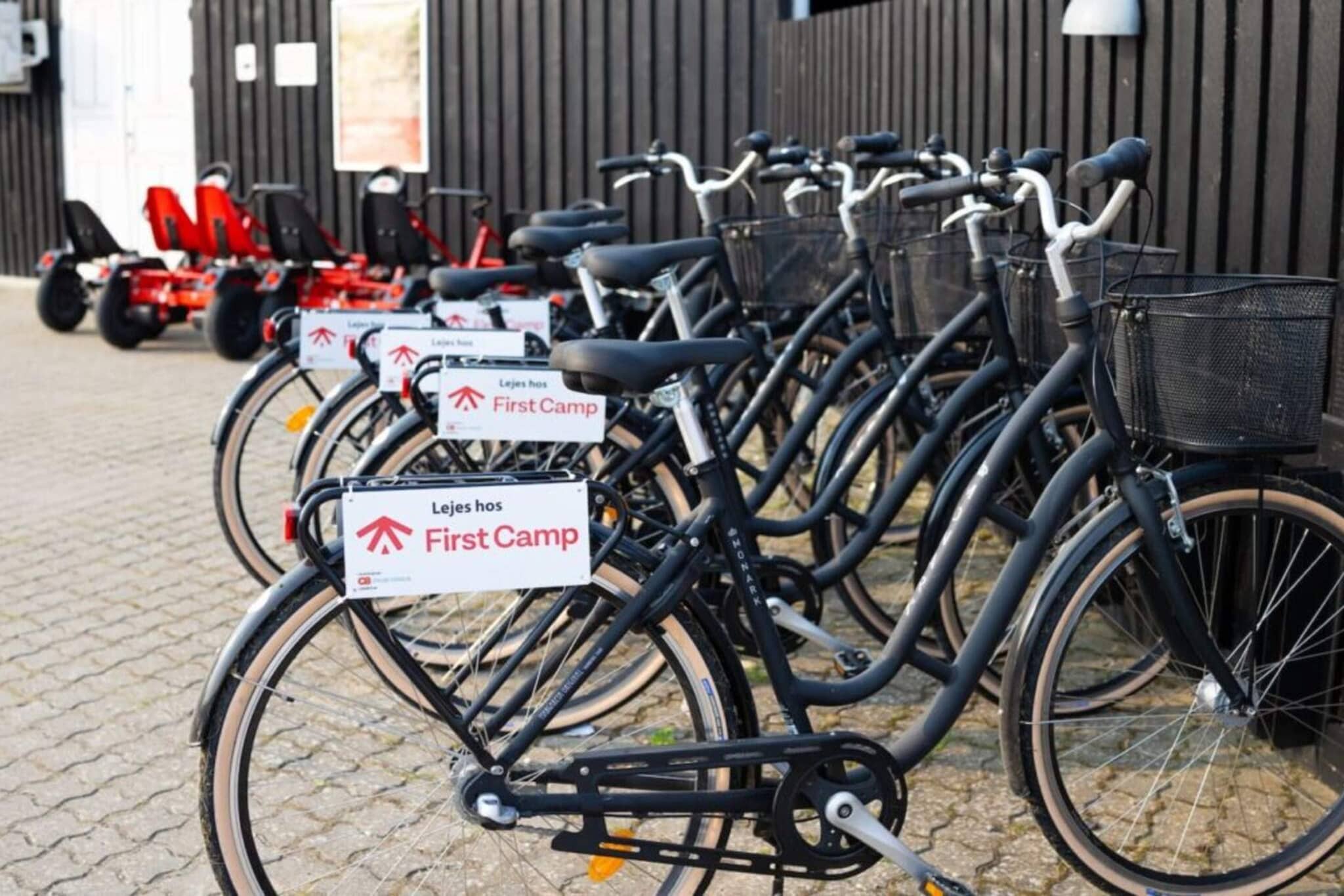 Welcome to First Camp Holbæk Fjord, a stunning destination nestled along the water's edge, offering a perfect blend of nature, tranquility, and adventure. Open year-round, our campsite is set in the heart of Zealand’s beautiful landscape. A place filled with exciting attractions and outdoor activities. Whether you're here for a peaceful retreat or looking for family-friendly fun, First Camp Holbæk Fjord is the ideal base to explore all that Zealand has to offer. Key Features: Year-round camping: Open all year for your convenience. Ideal for families: Nearby attractions such as Sommerland Sjælland, BonBon Land, and Tivoli. Big city access: Perfect starting point for exploring Copenhagen’s culture and attractions. Holiday cottages: Choose from a variety of cozy cabins that feel like small holiday homes, offering comfort and space. Great facilities: Enjoy well-equipped cabins and peaceful surroundings ideal for relaxation or adventure. Come and experience an unforgettable stay at First Camp Holbæk Fjord – your gateway to both serenity and exciting experiences on Zealand! Facilities: Bath Barrel: Relax in the Jacuzzi after a great day of camping Sauna: Take a deep breath, lean back and enjoy a relaxing moment in the sauna. Treat yourself to some alone time and relax, or enjoy the moment with someone. A simple way to make a wonderful day even better: a sauna trip is good for both body and soul. Childrens Pool: In our children's pool, the little ones can splash away; A sure favorite for all little campers. Here they can play and make as much trouble as they want, and maybe even practice the first swimming strokes? There are no scares here – the possibilities for splashing away are endless! Swimming pool: If you are looking for camping with a pool, then you found it! Our lovely covered swimming pool has plenty of space to romp in. Here, the water is always heated and there is absolutely no wind - so it can't get any better! The depth in our children's pool is 30 cm and in the large pool 150 cm. There are sun loungers, tables and chairs that everyone can use freely. As a guest with us, we make sure that your experience is top-notch, so you can relax and enjoy your holiday in the best possible way. Football pitch: If you love ball games, we have a grass field right outside the campsite. Here is plenty of opportunity to play, for example, a round ball or a good football match. It is not allowed to play after 21:00. Outdoor Gym: Do you love being able to keep up your workout when you're on vacation? At First Camp Holbæk Fjord, you have the opportunity to stay active while you are on holiday. We know how important it is to keep up the training, and we know that it is during the holidays that many temptations arise, so so that you do not have to take two steps forward and ten back, you have the opportunity to use our fitness machines and our scenic surroundings to maintain the strength and fitness that you have spent time building. With us, you will find a little bit of everything. The campsite and its surroundings offer several different types of exercise, so we are sure that there is also something that suits your taste. Bouncy: Come and jump on our fun bouncy cushion, which will quickly become a favorite for both young and old! Playground: Some of the most wonderful experiences and memories are created around the playgrounds at the campsite. This is where children and parents meet, share experiences, and meet friends for life. Therefore, the playground is in our utmost interest to develop, highlight and share with our guests!