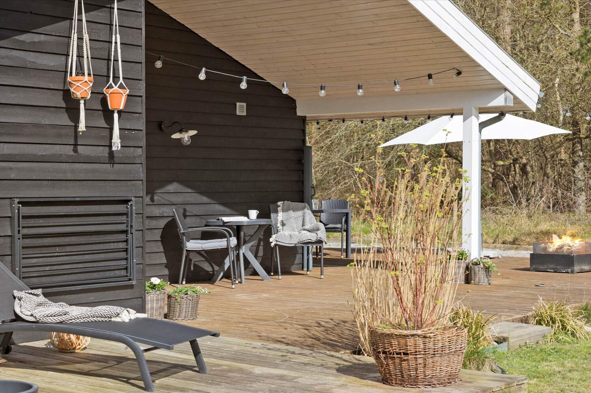 Welcome to this beautiful holiday home located in scenic Lyngså near Kattegat – a gem for those seeking peace and relaxation in scenic surroundings. The house is situated on a spacious plot of over 6,000 m2, surrounded by dense vegetation that gives the feeling of being in the middle of the forest. From the grounds, there is a breathtaking view of the meadow and out towards the Kattegat, where the sound of waves and bird life sets the scene for an unforgettable vacation. The cottage has been newly renovated and has a beautiful new kitchen in classic cottage style. The open kitchen/family room and living room are the heart of the house and feature high ceilings and large windows that let the light flood in. The large living room has both a wood-burning stove and a modern heat pump, ensuring warmth and comfort all year round. The living room has direct access to a large, partially covered terrace – perfect for relaxing in the shade or under the starry sky in the evening. With three good bedrooms and a spacious loft with a double bed, there is room for the whole family or group of friends. The bathroom is luxurious with both a spa bath, sauna, and underfloor heating, and the guest toilet is an added convenience. For those who appreciate practical solutions, the entrance hall is designed as a utility room with a washing machine and dryer. The cottage has a wonderful outdoor shower, which is connected from May 1 to after the autumn break – the perfect way to cool off in the hot summer months. Start the morning with a refreshing outdoor shower experience to the sound of birds singing. As an added bonus, we also offer two girls' bikes, which are free to use, so you can easily explore the beautiful area. There is a trampoline and soccer goals. The cottage is ideal for nature lovers and those seeking a vacation in peaceful surroundings with forests, meadows, and beaches close at hand. Lyngså and nearby Voerså offer pleasant harbor environments and shopping opportunities, while the larger towns of Sæby and Frederikshavn are within a short driving distance. Not available for rental to youth groups or construction crews.A refundable deposit might be charged closer to your check-in date. The security deposit ensures a smooth stay and covers any additional services or consumption charges.This deposit covers utilities consumed during your stay and any additional services that may be taken.The final amount will be adjusted based on actual meter readings, actual usage of extra services, and any remaining balance will be refunded within 21 days after checkout.This deposit simply acts as a prepayment for charges that  you would anyways pay for, ensuring a seamless stay and check-out experience.