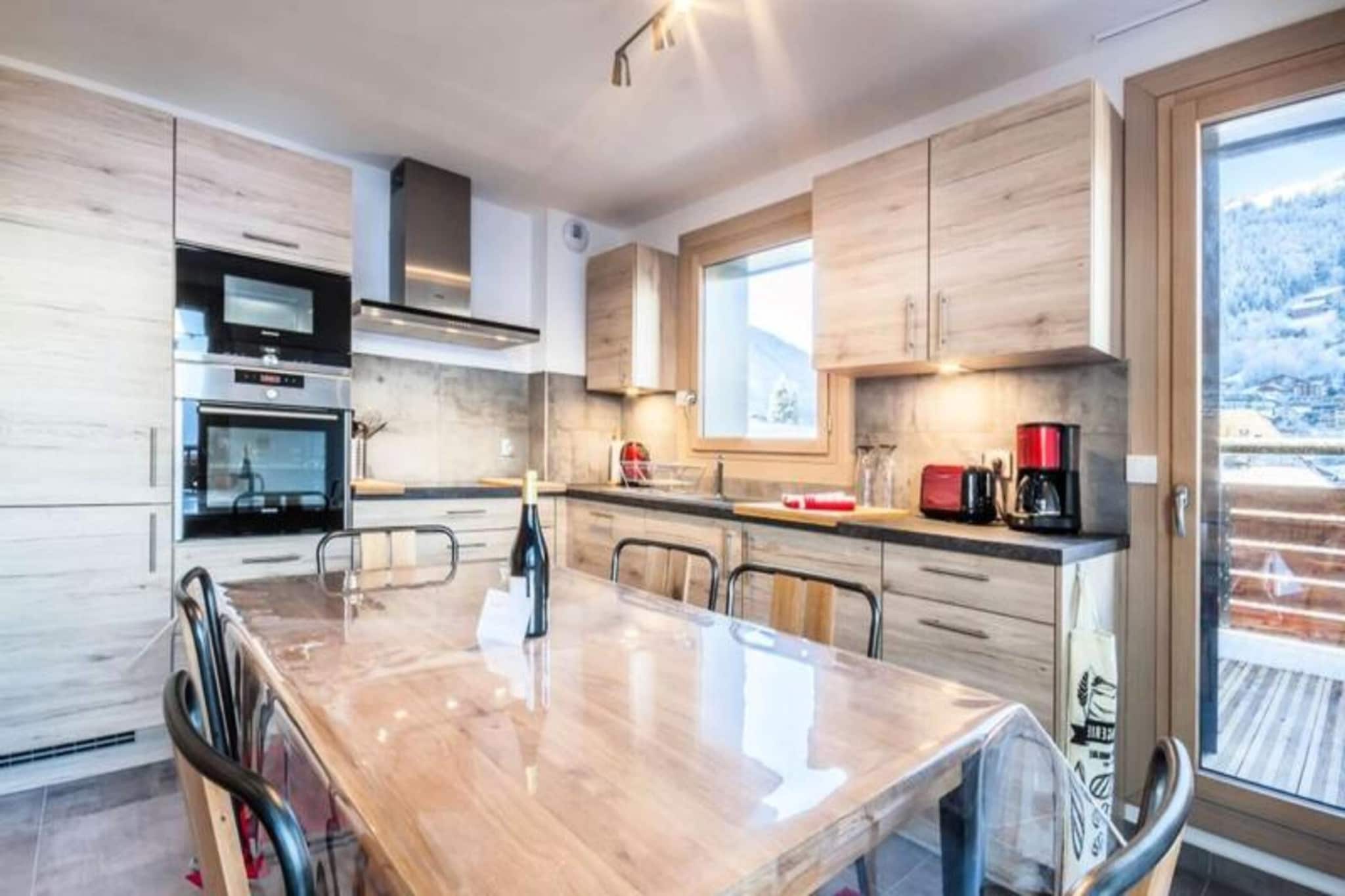 This stunning apartment, located in one of the best spots in Morzine, offers direct access to the Pleney slopes and is just steps away from restaurants, bars, and shops. The high-end construction blends contemporary design with traditional mountain charm, creating a welcoming and stylish space. Situated on the second floor with elevator access, the apartment features a spacious entrance, a cozy living room with a sofa bed, and an open kitchen that leads to a balcony. There are two well-appointed bedrooms, each with either two single beds or a double bed and a television. A separate sleeping area with two bunk beds provides additional space. The apartment also includes a bathroom with a toilet, a shower room, and another separate toilet.

As a Summer Multipass Member, guests can enjoy discounts on local activities. The apartment is conveniently located for both winter sports and summer activities, with easy access to ski lifts and hiking or mountain biking trails. Explore the vibrant village of Morzine, filled with shops, cafes, and après-ski options.

Additional amenities include WiFi, a washing machine, a dishwasher, and secure parking in a garage (with specific dimensions). Guests also have access to a cellar and a ski locker. Sheets, towels, and beds made upon arrival are provided, with mid-stay and end-of-stay cleaning included.