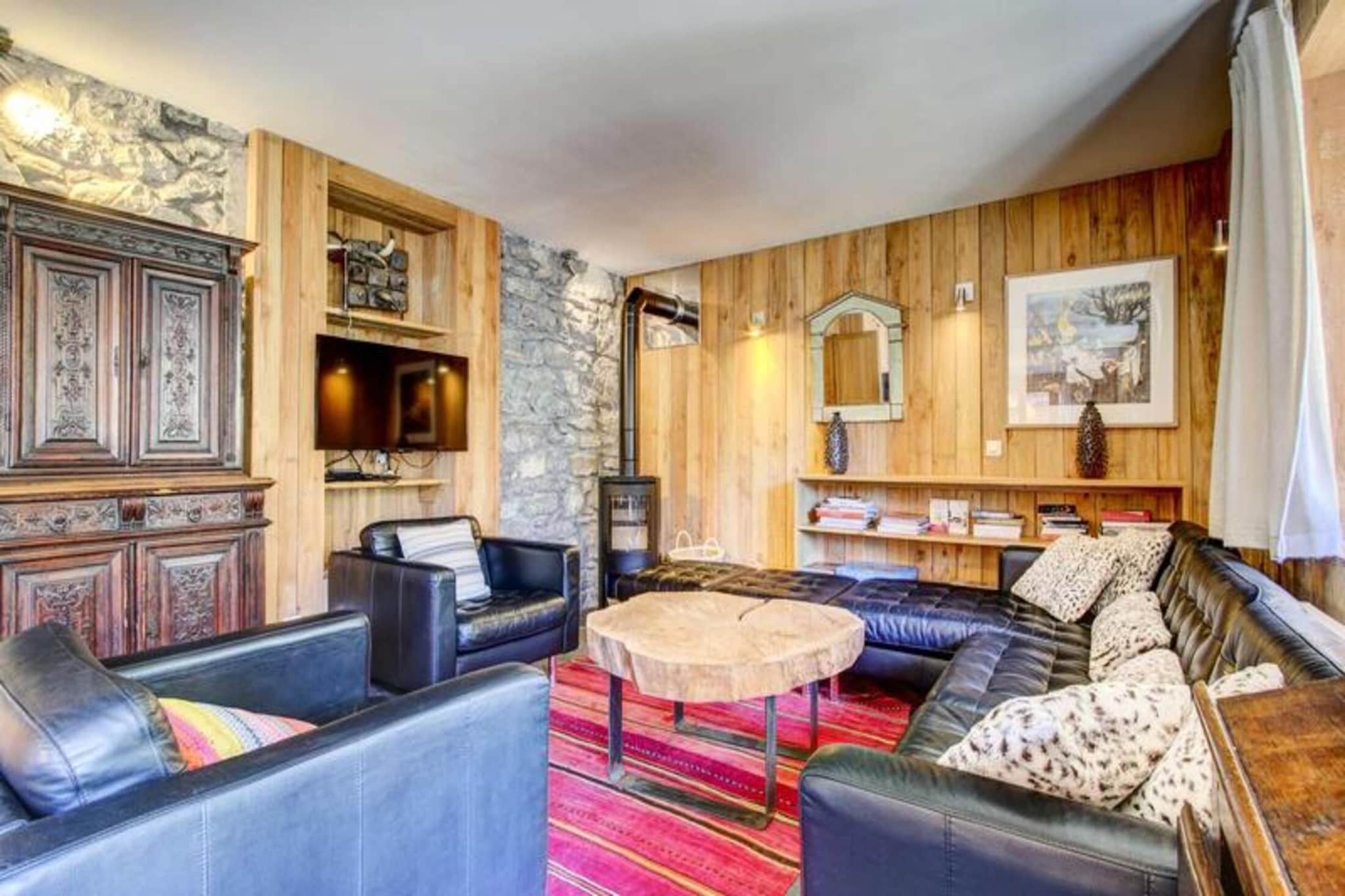 This stunning ground-floor apartment, located in a fully renovated chalet, offers a perfect blend of contemporary design and alpine charm. Situated just 650m from the center of Morzine and the Pleney ski lifts, and only 500m from the ESF ski school, it’s ideal for those wanting to experience both winter sports and the lively village atmosphere. A free shuttle stop is conveniently located less than 100m away, providing easy access to the resort.

The apartment is also part of the Summer Multipass program, offering access to various attractions in the area during the summer months. Enjoy a range of activities including hiking, mountain biking, and exploring the beautiful landscapes of the Alps. With sheets, towels, and end-of-stay cleaning included, this property offers a hassle-free and comfortable stay in Morzine.

The spacious apartment features a large open-plan living area with a wood stove, leading to a 40m² East-facing terrace, perfect for enjoying the mountain views. It includes four bedrooms, each with an en-suite shower or bathroom, providing ample privacy and comfort. A fully equipped kitchen allows for easy meal preparation, while the laundry room with a washing machine and dryer adds convenience. Guests can make use of the shared ski room with boot dryers and private outdoor parking.


