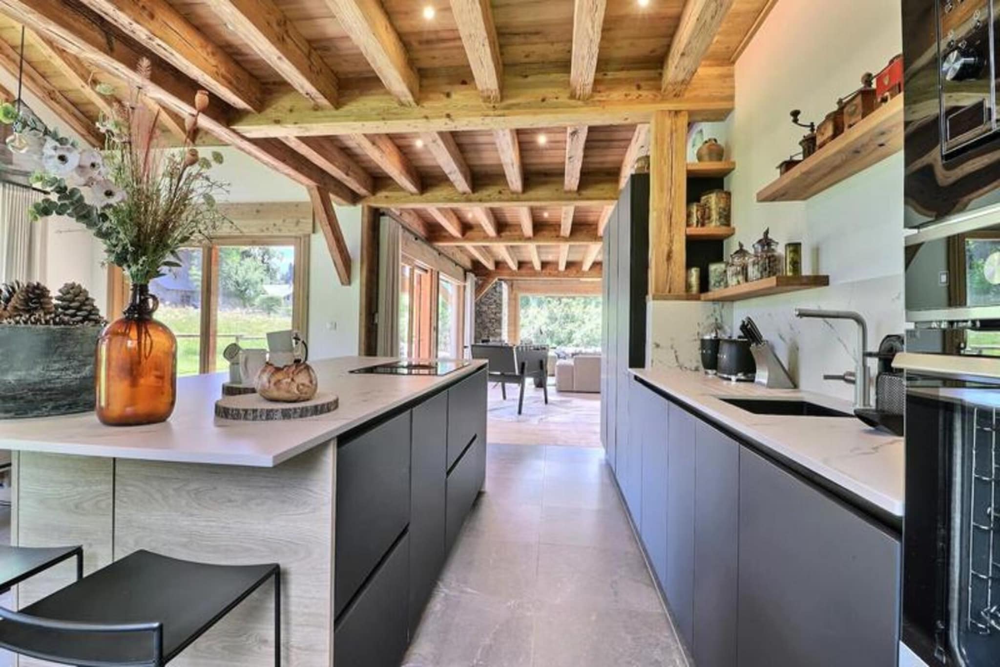 Property, along with its luxurious features, offers a spacious chalet designed to accommodate up to 12 people. The chalet includes a variety of comfortable sleeping arrangements, with double en-suite bedrooms and a family room with a double bed and bunk beds. Guests can also enjoy a cozy living room with a fireplace, television, and table football, as well as a large kitchen open to the living area. The property provides ample amenities including a private outdoor Jacuzzi, sauna, and six televisions with access to both French and English channels. While pets are not allowed, the chalet provides towels, bed linen, and access to high-speed internet. Additional services, such as ski equipment rentals and airport transfers, are available upon request.

Located just 2.6 km from the center of Morzine, the chalet is ideally situated for both winter and summer activities. The resort offers a wide range of experiences for outdoor enthusiasts, including access to the vast Portes du Soleil ski area, known for its 286 ski slopes. In the summer, the area transforms into a haven for hikers, mountain bikers, and golfers. The chalet is also conveniently located near a bakery (700 meters away) and has access to a free shuttle service (500 meters away). The slopes at Pleney are just 2.3 km from the property, ensuring easy access to skiing and snowboarding. The surrounding landscape is perfect for enjoying the stunning views and engaging in various mountain sports, while also offering the charm of nearby villages.

The chalet is equipped with a fully fitted kitchen, offering everything needed for preparing meals, and a dedicated ski room with boot and glove dryers for convenience after a day on the slopes. For additional relaxation, guests can enjoy the outdoor Jacuzzi or unwind in the sauna, which is equipped with a shower and washbasin. The chalet also includes a laundry room with a washing machine, dryer, and extra refrigerator, ensuring a comfortable stay. The private garage provides secure parking, and the large terrace offers breathtaking mountain views. With its combination of modern amenities and proximity to both outdoor activities and local conveniences, this chalet ensures an exceptional vacation experience for all guests.


