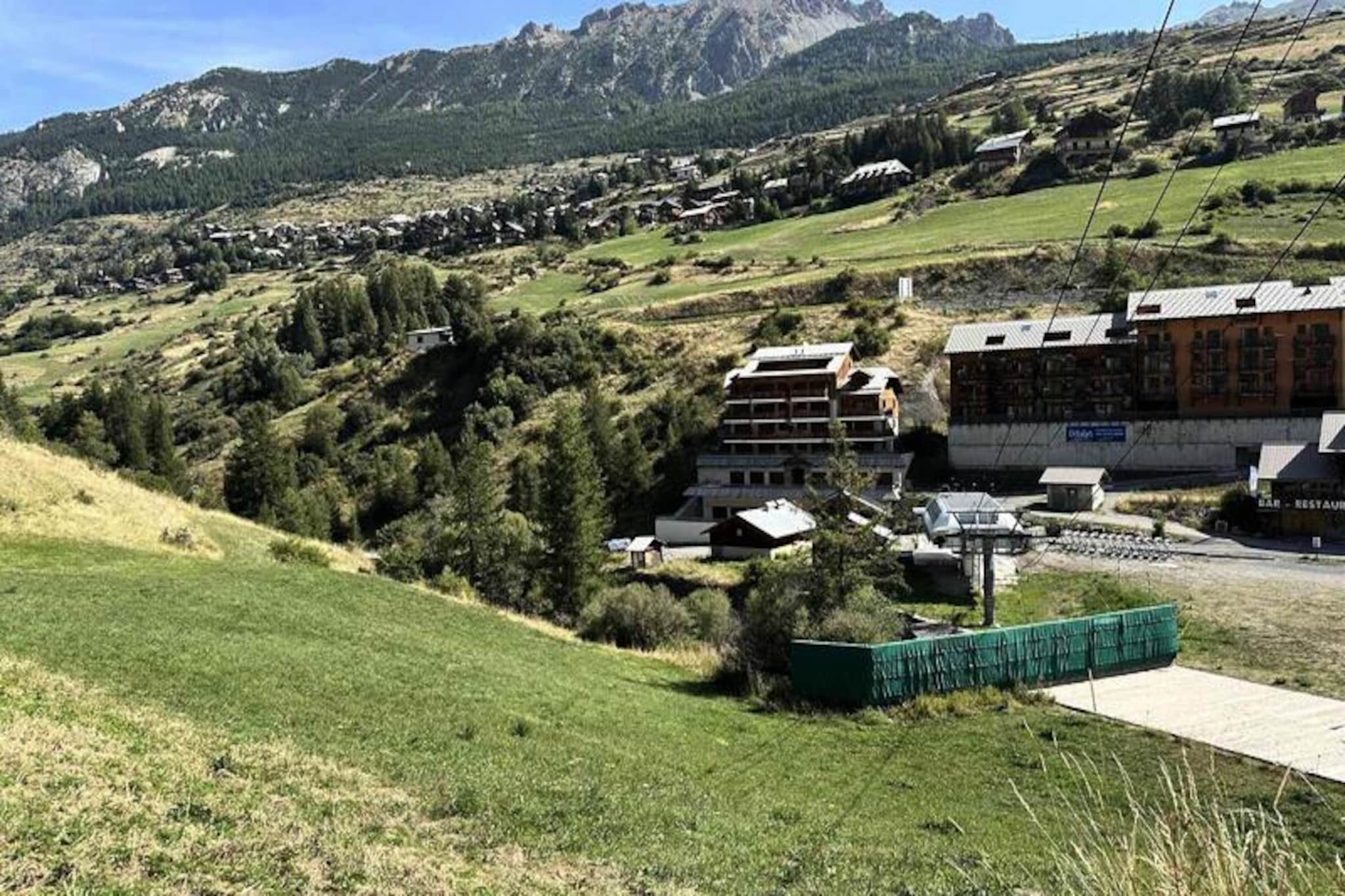 The property, along with its elegant and spacious layout, offers comfortable accommodation for up to six people. The apartment features two double bedrooms and one bedroom with a bunk bed, providing ample sleeping arrangements for families or small groups. The living area is open and inviting, with a terrace offering a beautiful view of the Sainte-Marie slopes, complemented by a balcony facing southeast. While pets are not allowed, guests can opt for additional services such as renting bed linen and towels for a fee. Notably, the property is non-smoking and requires a deposit upon booking. Although there is no end-of-stay cleaning included, it is available for an additional charge.

Located at the foot of the Sainte-Marie slopes, this residence offers privileged access for ski enthusiasts, making it an ideal choice for a winter getaway. Guests can enjoy the convenience of a nearby free shuttle stop, which provides easy access to the resort center in just 15 to 20 minutes. Whether you are here for skiing, hiking, or simply to unwind, the residence's proximity to outdoor activities and the surrounding natural beauty provides the perfect setting for an active or relaxing vacation. The property’s central location in a small mountain village further enhances its appeal, offering a peaceful retreat with easy access to local attractions.

The apartment is well-equipped with modern amenities to ensure a convenient stay. The kitchen includes essential appliances such as a dishwasher, fridge/freezer, induction hobs, traditional oven, microwave, toaster, kettle, and even a Tassimo coffee machine. Additionally, guests can enjoy the convenience of a washing machine and specialty appliances like a waffle and fondue maker, perfect for cozy evenings. With everything you need to prepare and enjoy meals, the apartment ensures a comfortable and self-sufficient experience for guests.
