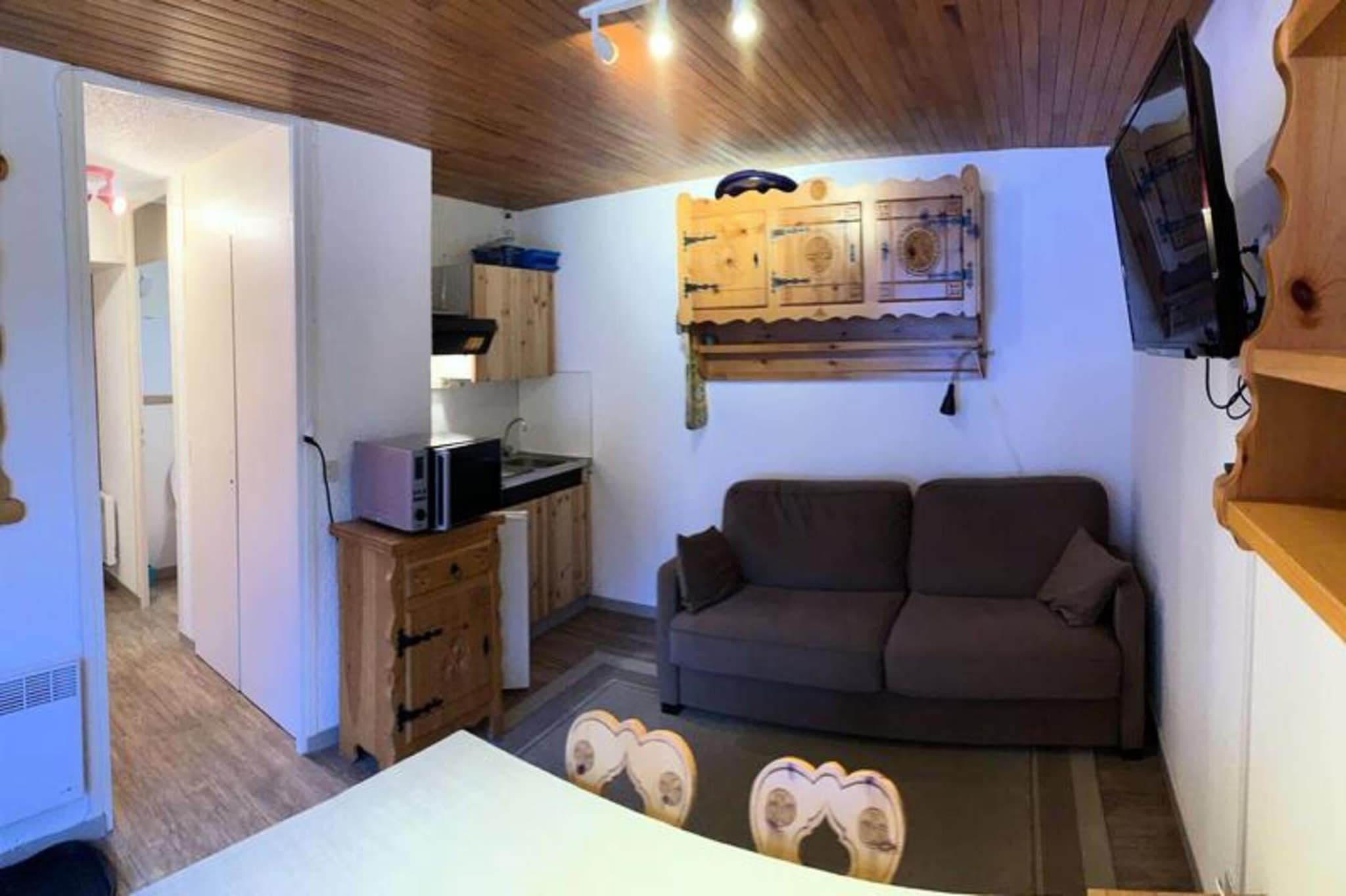 Property along with a cozy and practical design offers a studio cabin apartment that can accommodate up to four people. The apartment features a mountain corner with two bunk beds and a sofa bed in the living room, perfect for families or small groups. The living room is oriented to the southwest, ensuring natural light throughout the day. Guests can also enjoy a flat-screen TV for entertainment. The apartment provides easy access to the slopes, with the added convenience of ski-in and ski-out facilities. Bed linen and towels are available at an additional cost, and a ski locker is provided for storing gear.

Located in the heart of the Vars Risoul area, this property offers direct access to skiing, allowing guests to depart and return on skis. The residence is situated at the foot of the slopes, providing excellent proximity to the ski areas. For those looking to explore beyond the resort, local shops, attractions, and amenities are within reach. The region’s natural beauty and outdoor activities, such as skiing and snowboarding, make it an ideal destination for winter sports enthusiasts.

The apartment is equipped with basic amenities to ensure comfort during your stay, including a bathroom, heating, and end-of-stay cleaning. While bed linen and towels are not provided, they can be rented on-site for an additional charge. A credit card deposit and tourist taxes are required upon arrival. The apartment’s simple yet functional design and prime location at the foot of the slopes make it a great base for a mountain getaway.