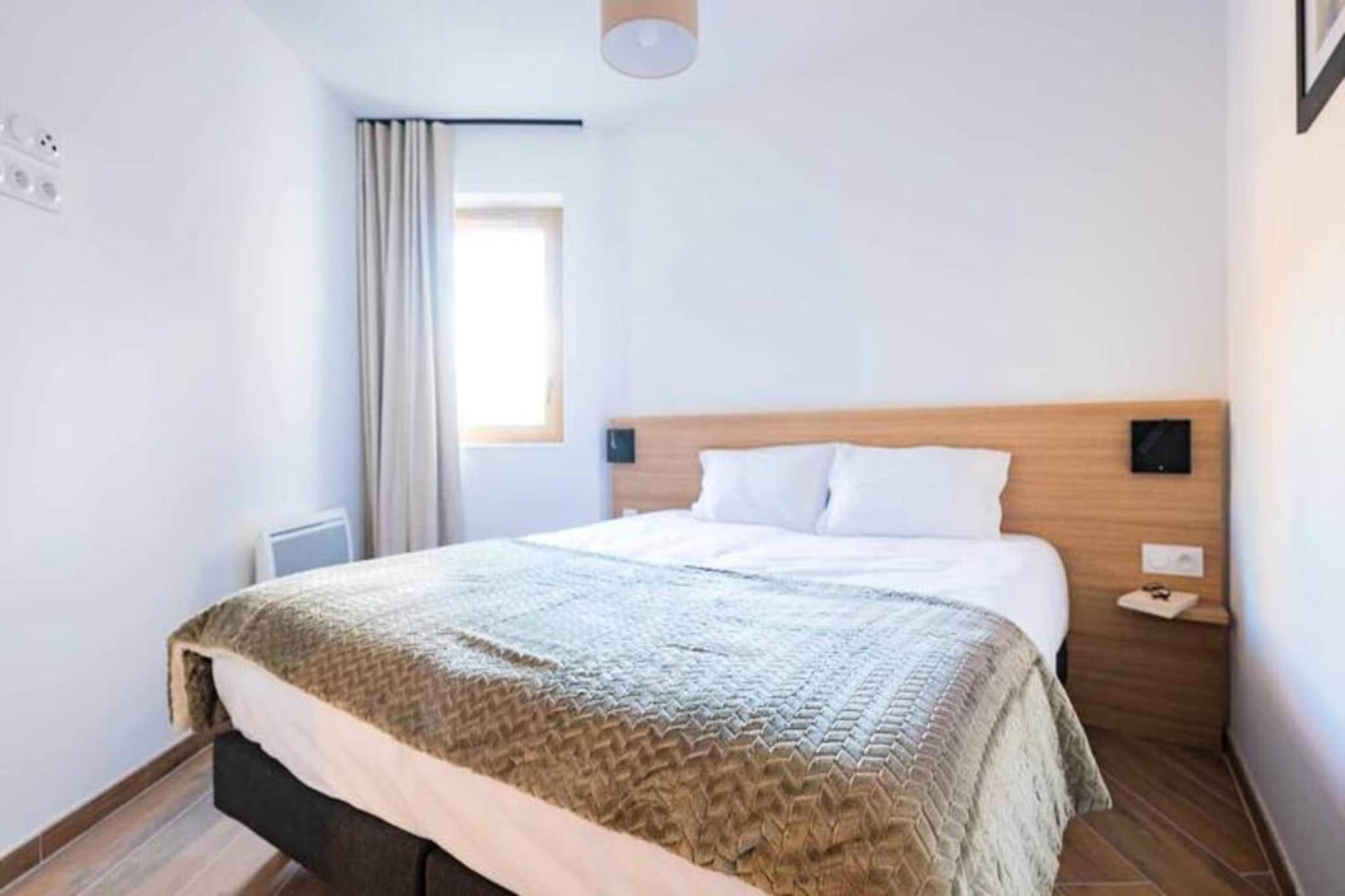 This charming apartment, ranging from 38 to 46m², offers a comfortable and convenient stay for families or small groups. The living room features a double sofa bed, perfect for relaxing or accommodating extra guests. The kitchenette is fully equipped, allowing you to prepare meals with ease.  

The apartment is ideally located near local attractions, including the vibrant village center, ski slopes, and a variety of shops and restaurants. The area offers easy access to outdoor activities, such as skiing, hiking, and exploring the stunning alpine landscape. Whether you're seeking adventure or relaxation, this apartment provides a perfect base for your mountain getaway.

The apartment includes a bedroom with either two single beds or one double bed, as well as an additional bedroom with two single beds, ensuring ample sleeping arrangements. A bathroom or shower room, along with a separate WC, adds to the apartment's convenience. Step outside onto the balcony to enjoy the fresh air and beautiful surroundings.