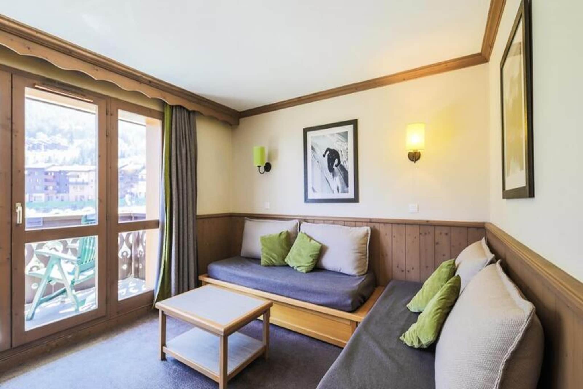 Located in the picturesque La Forêt district of Savoie, the Valmorel resort offers a serene escape surrounded by lush green nature and stunning mountain peaks. The Quartier La Forêt is a pedestrian-friendly, family-oriented area, offering traditional Savoyard chalet-inspired vacation rentals. Just 3 to 5 minutes on foot from the nearest ski lift, these charming residences are conveniently close to the Maeva Home agency and local shops. Whether you stay in The Athamant, Valerian, Fir Tree, Stream, Pebble, Crowberry, Log, or Bud buildings, you'll enjoy a peaceful atmosphere, with easy access to both the ski slopes and village amenities.

Additional services such as baby kits, bed linens, and cleaning are available for an extra charge. Parking can be reserved through Valmorel, with free parking during the summer. Enjoy a perfect blend of relaxation and adventure in the heart of the French Alps.

This particular apartment, located on the 2nd floor of the Valérian building, spans 39 m² and is perfect for small families or groups, offering a living room with a pull-out sofa bed for two, a dining area, and an open kitchen. The bedroom features a comfortable double bed, while the cabin area offers two single bunk beds. Two bathrooms include a bathtub and WC, plus a shower and WC for added convenience. The apartment also boasts a balcony to enjoy the mountain views.


